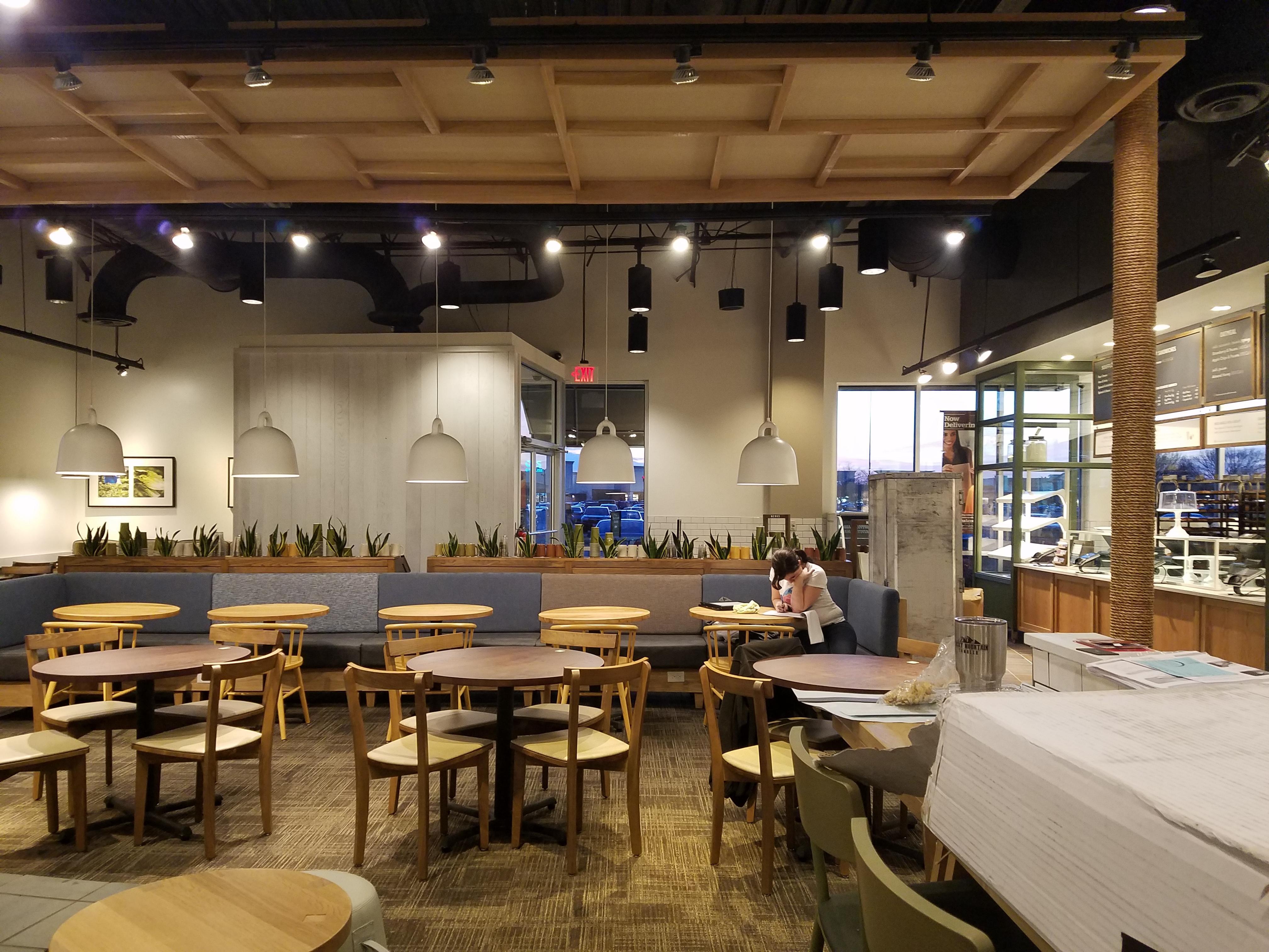 Fabric wrapped panels on the ceiling at a Panera Brea reduce echo and reverberation.