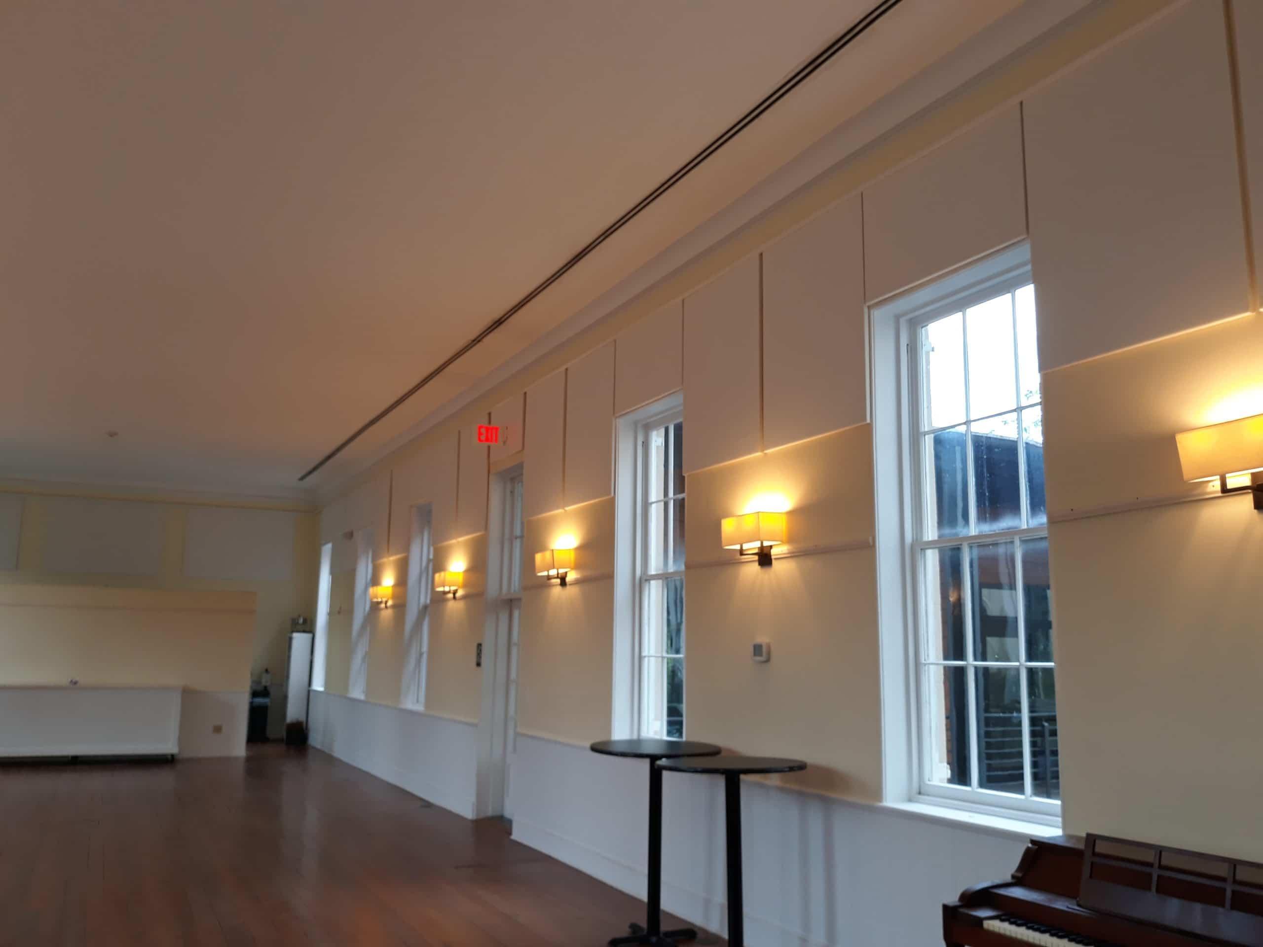 The echo and noise in the Circular Congregational church meeting hall is greatly reduced by fabric wrapped acoustic panels.