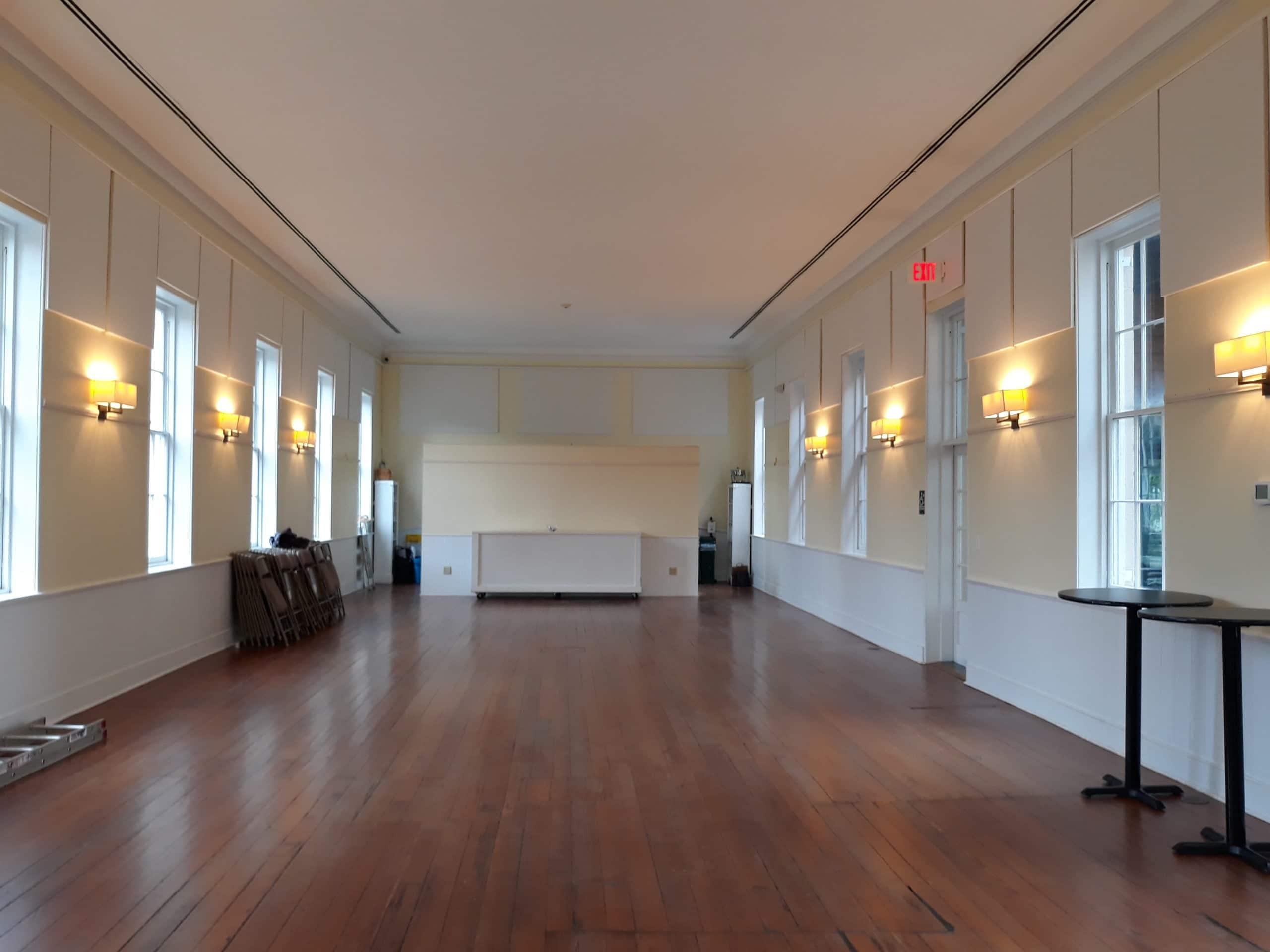 Fabric wrapped panels reduce noise in the meeting room of Circular Congregational church.