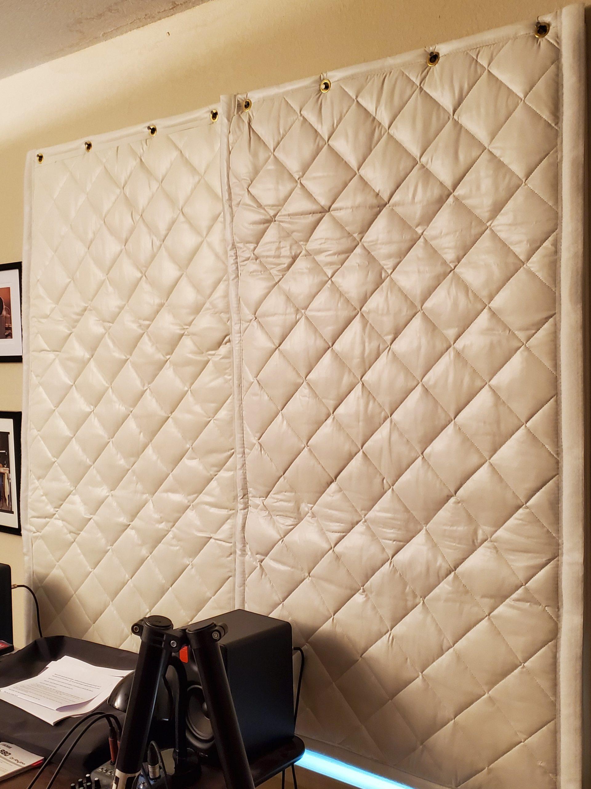 Soundproofing blankets reduced reverberation and blocked sounds in a residential music room.