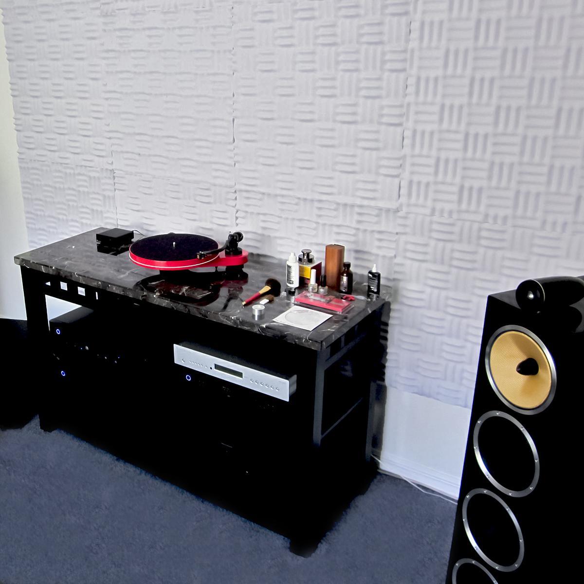 A complete acoustic treatment combining acoustic foam and foam bass traps  optimizes Eric's media room for listening. 