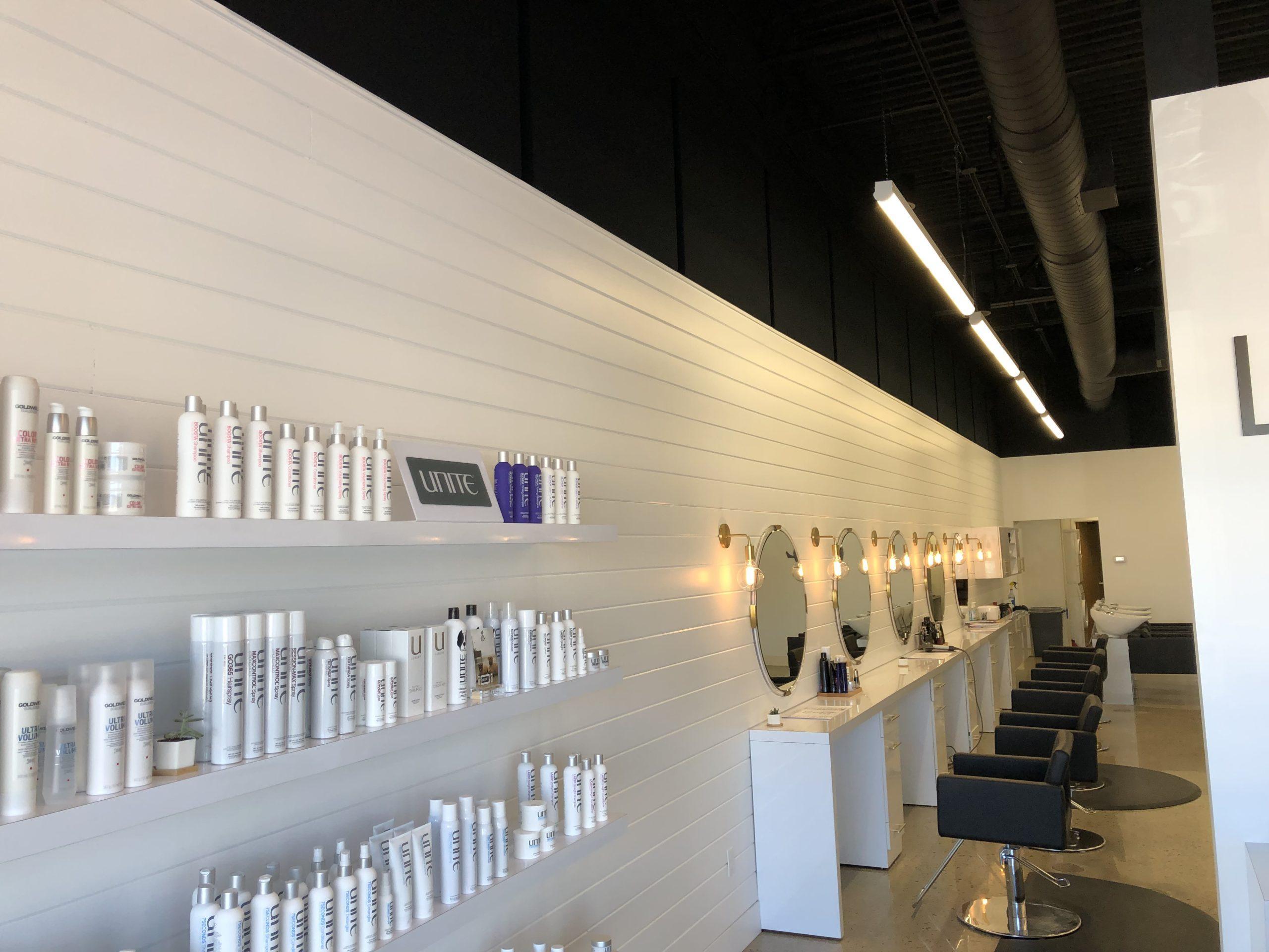 Fabric wrapped panels on the wall at Lucas Salon treat the acoustics.