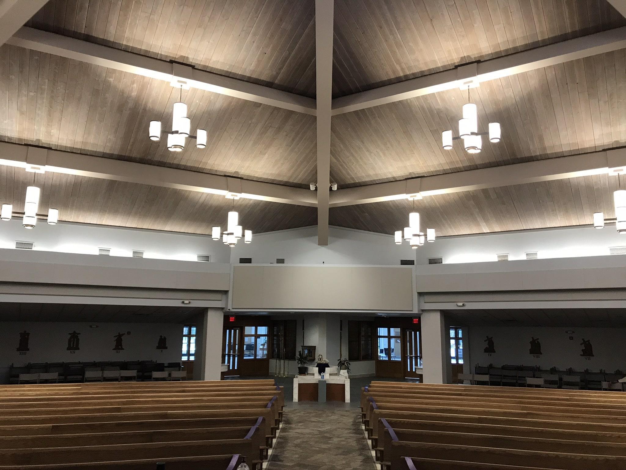 Sound absorbing panels reduced echo and improved speech intelligibility in St. Edward's worship space.