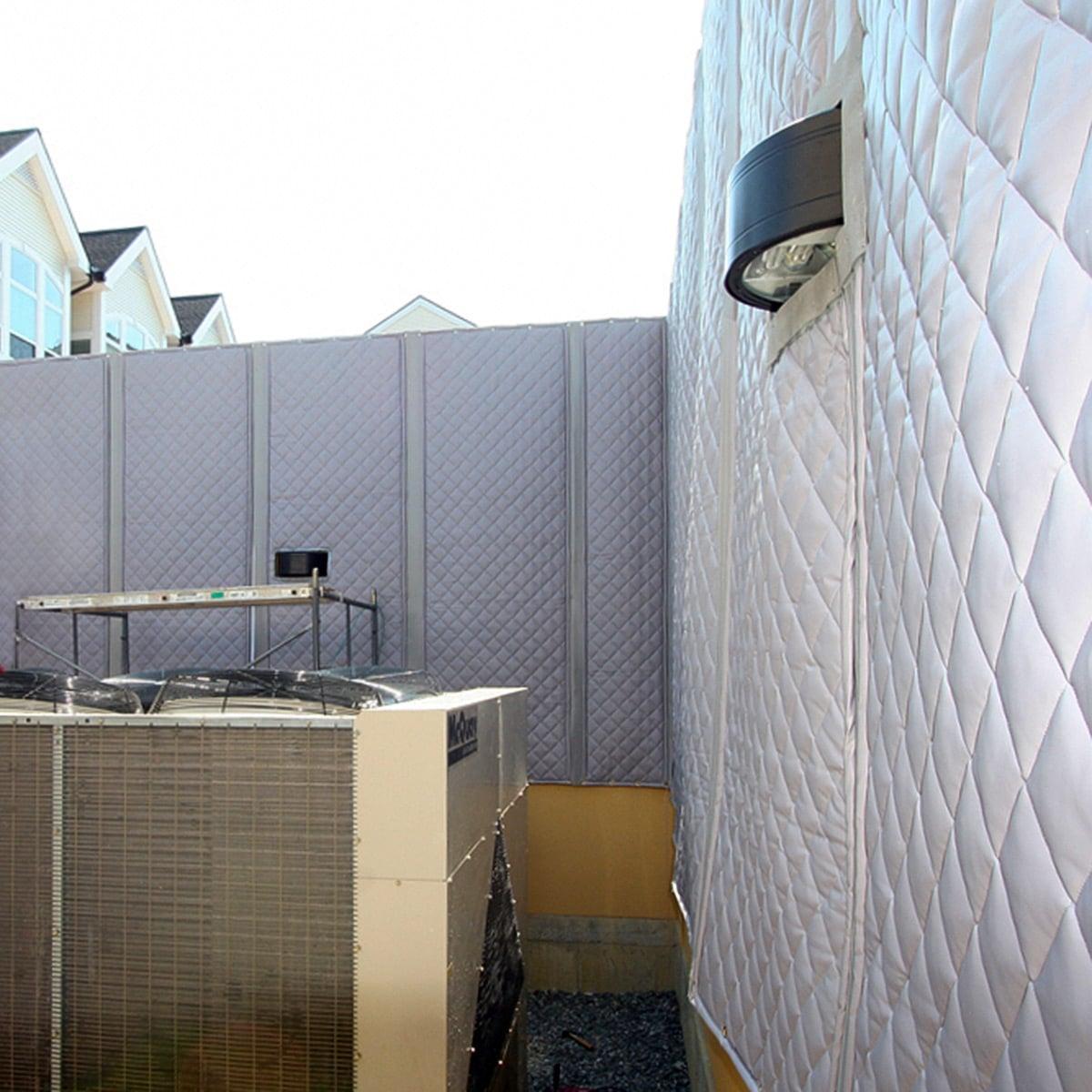 The PrivacyShield® Outdoor Absorptive Soundproofing Blanket used to mitigate sound coming from a commercial chiller in a residential area.