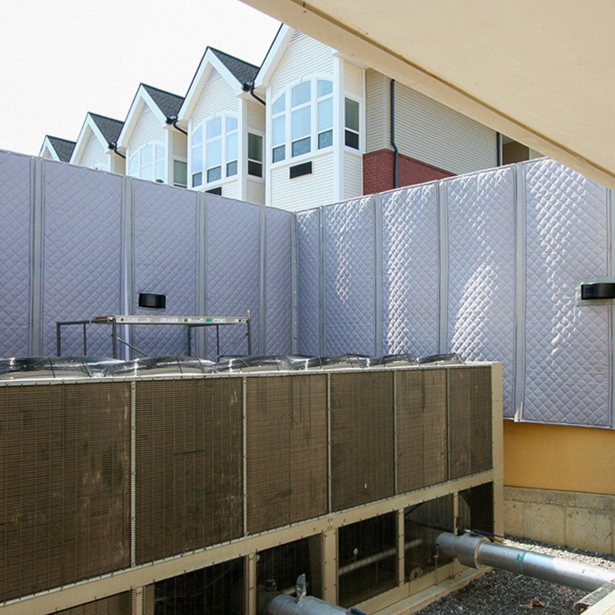 The PrivacyShield® Outdoor Absorptive Soundproofing Blanket used to mitigate sound coming from a commercial chiller in a residential area.