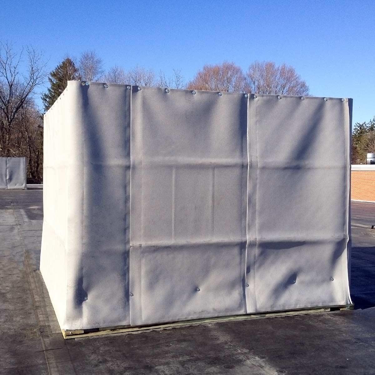 The PrivacyShield® Outdoor Absorptive Soundproofing Blanket used for rooftop equipment enclosures at a school.