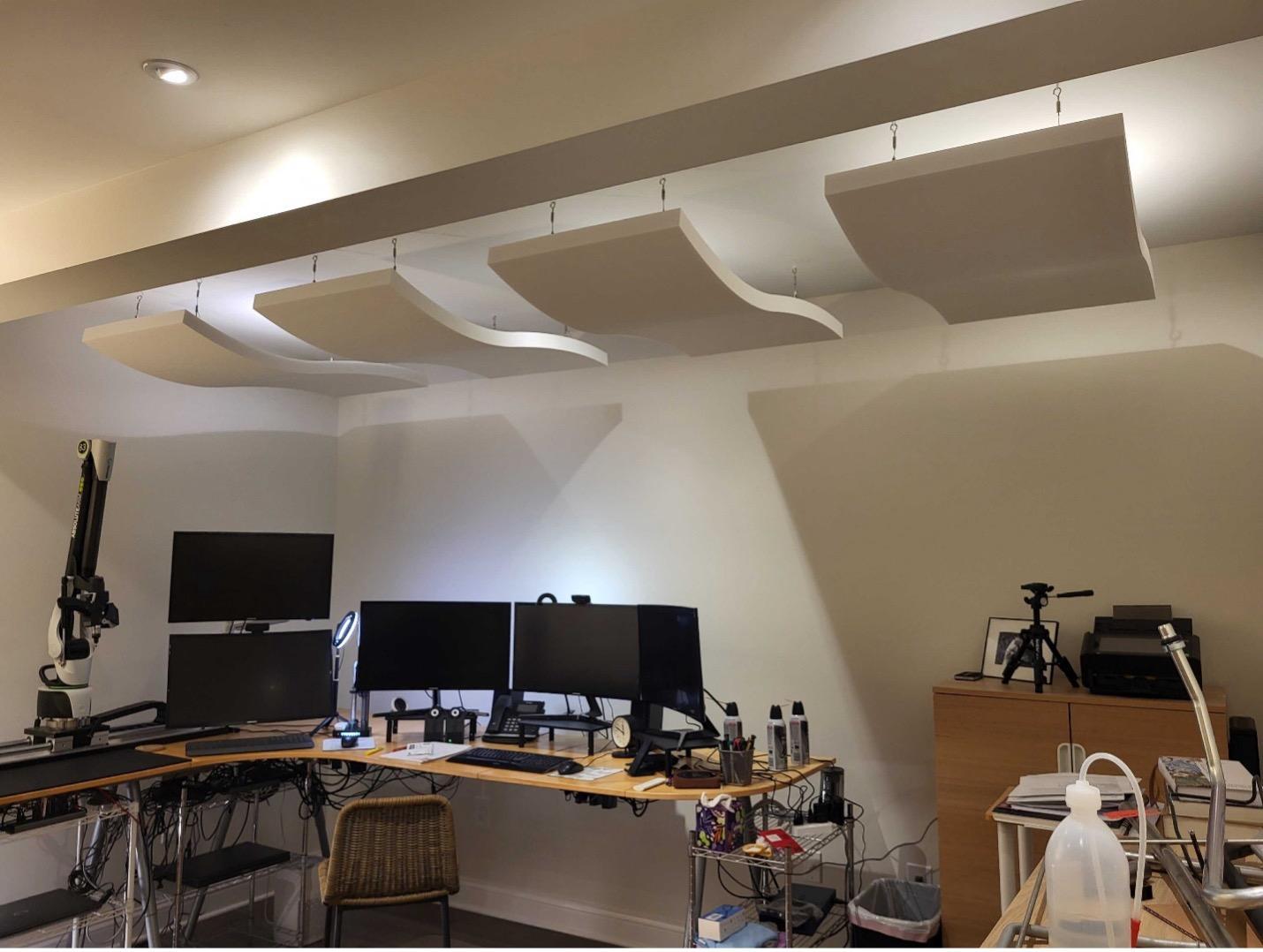 Acoustic ceiling clouds reduce noise level, echo, and reverberation in the Advanced Tubular Technologies office space.