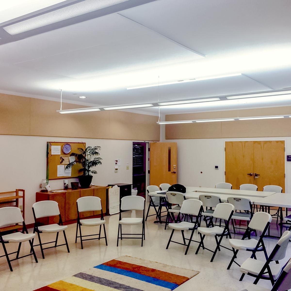 The echo and noise in the Advent Lutheran Church assembly room is greatly reduced by  acoustic panel installation on the ceiling and walls.