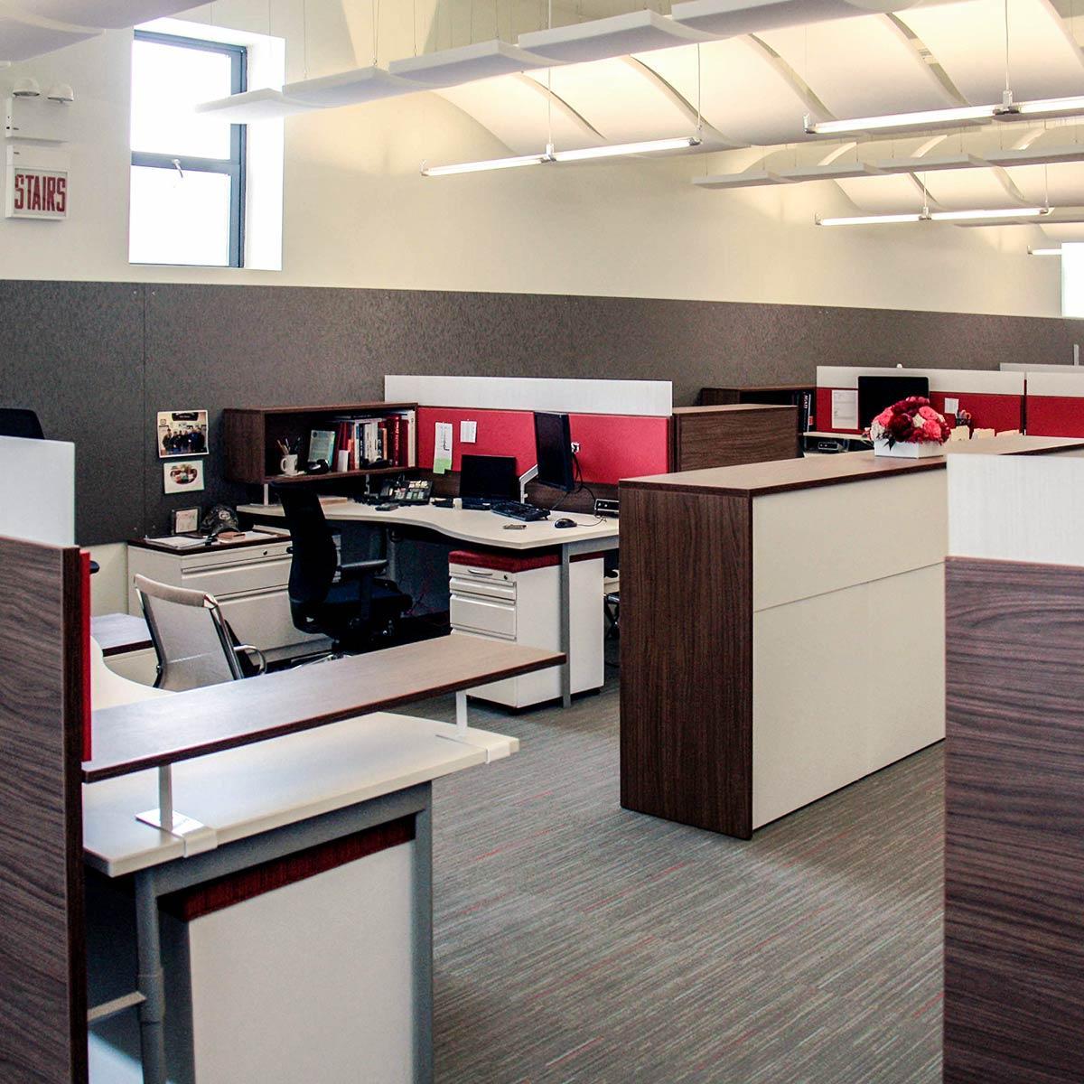 Agati Furniture - Open office plan using red AlphaSorb® panels and Sonex® Whisperwave® Clouds in ceiling.