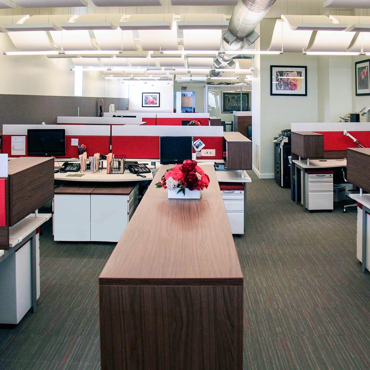 Agati Furniture - Open office plan using red AlphaSorb® panels and Sonex® Whisperwave® Clouds in ceiling.