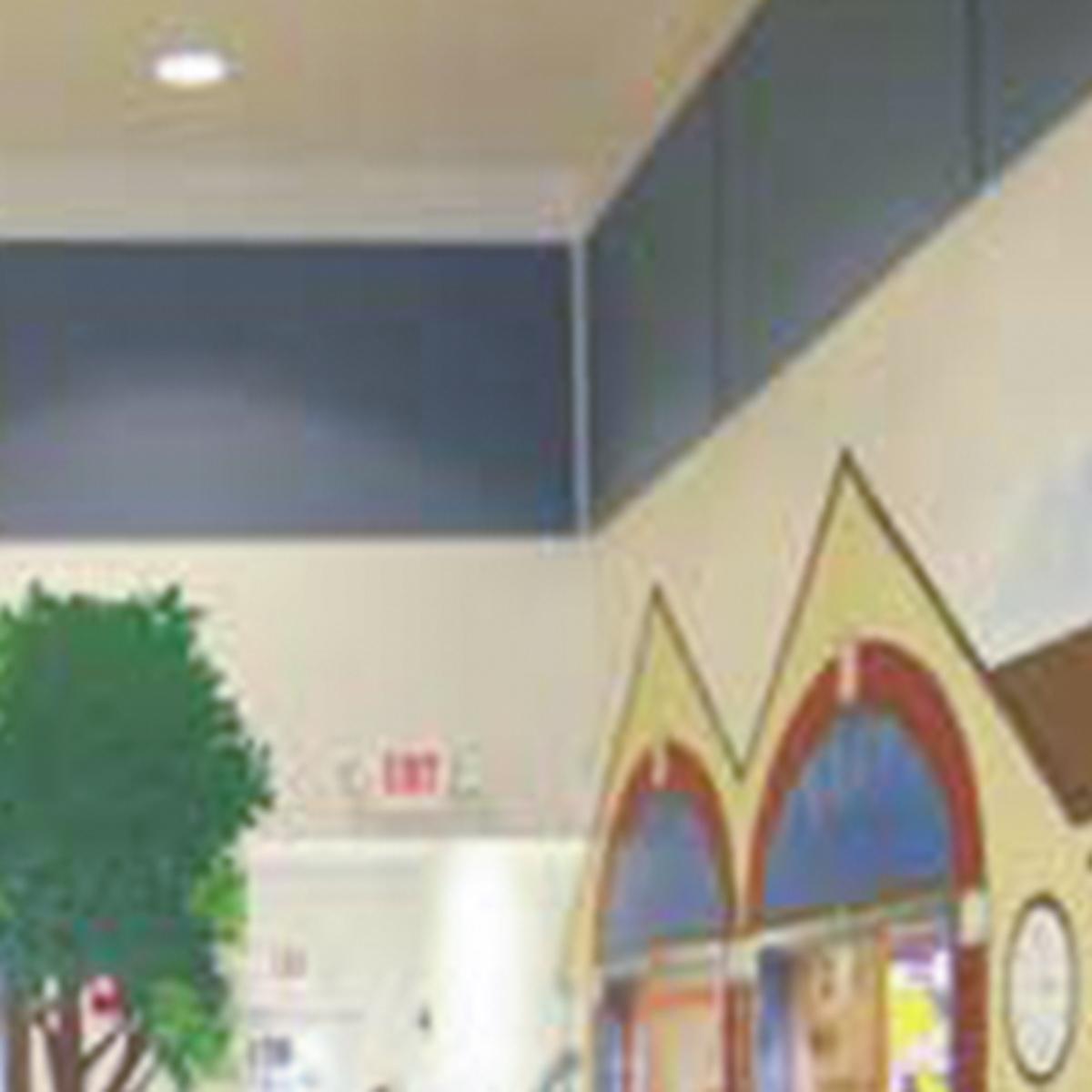 Fabric wrapped acoustic panels line the walls of the All Aboard Learning Center.
