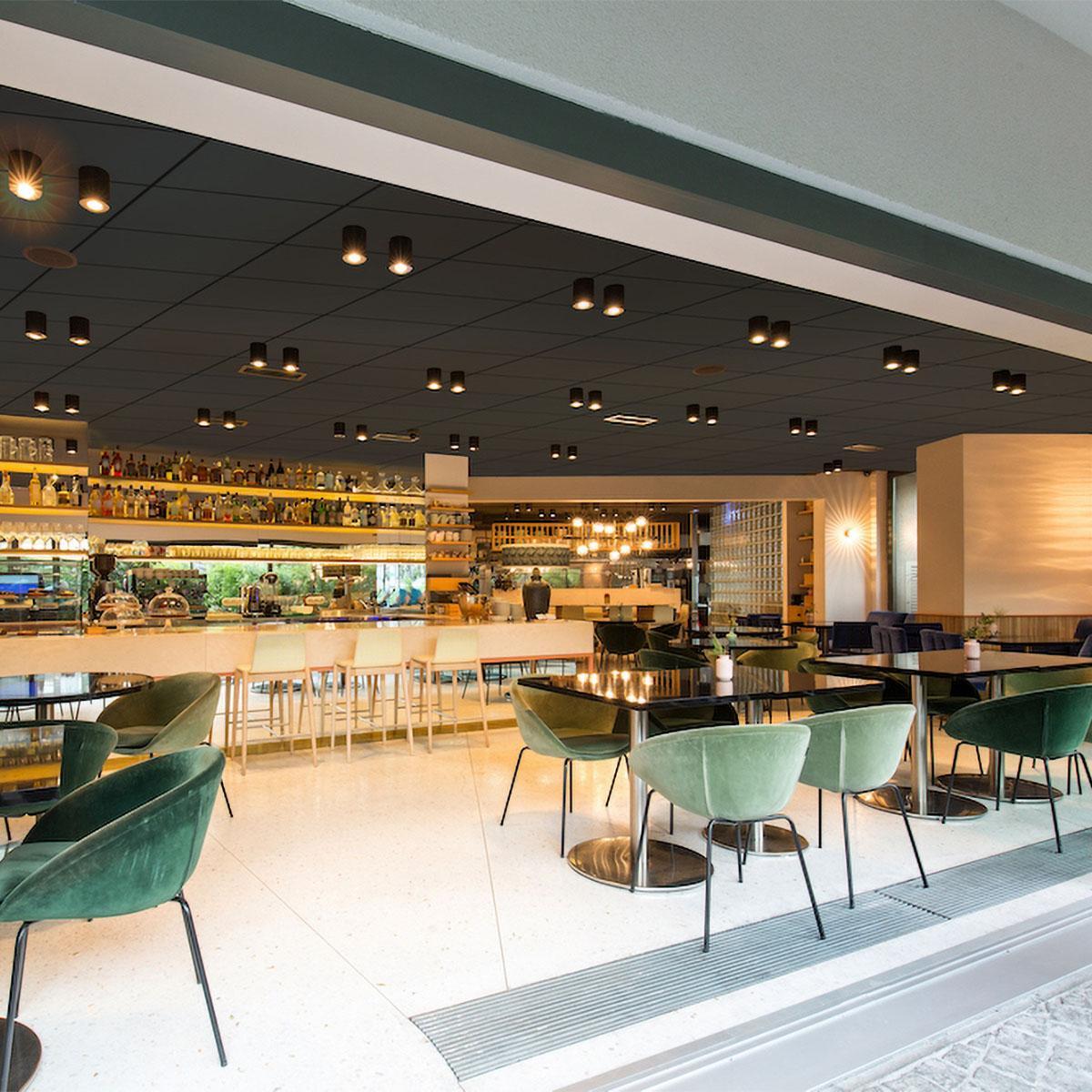 AlphaSorb Acoustic Ceiling Tiles or PrivacyShield Soundproofing Sound Barrier Ceiling Tiles in Black Felt in a Restaurant Bar