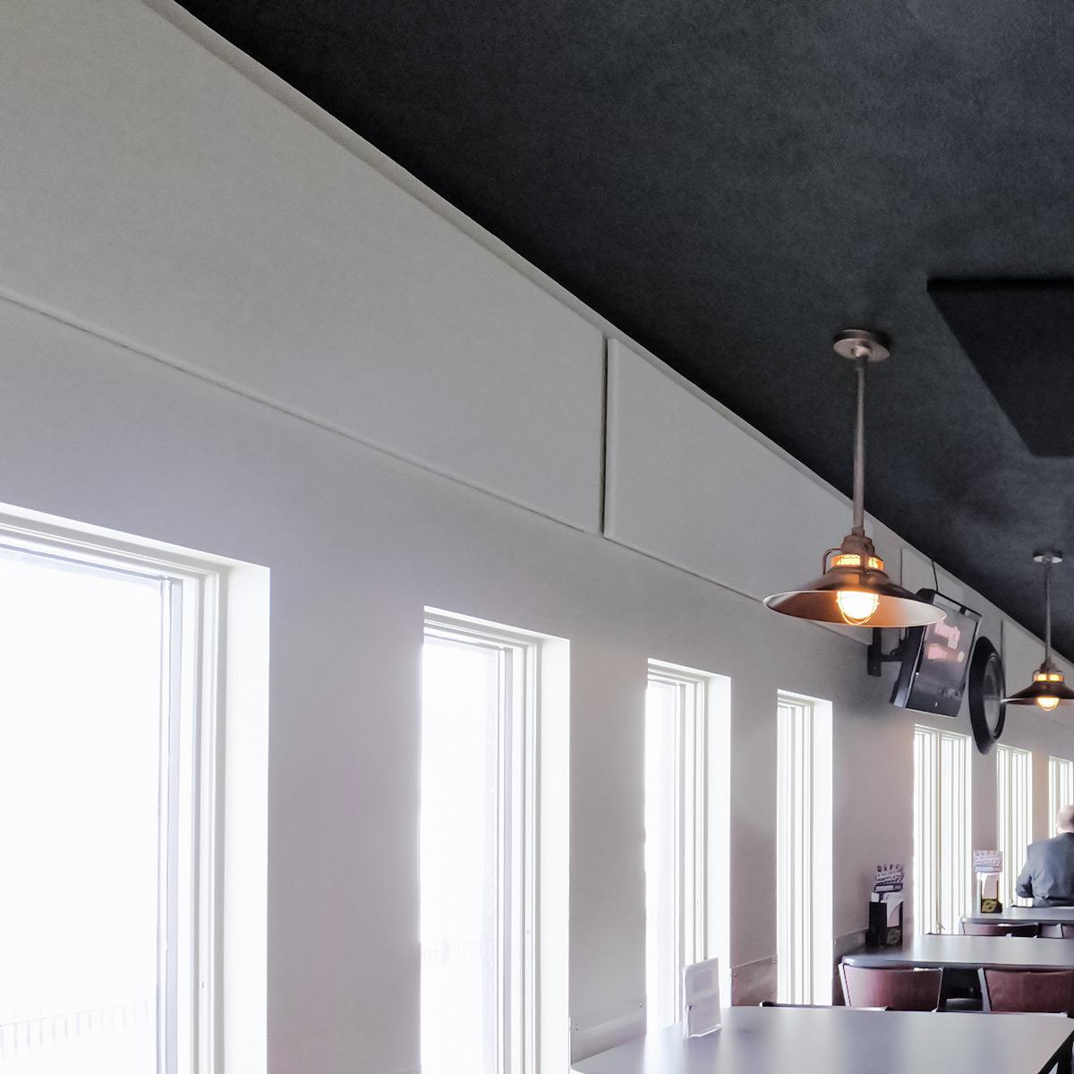 Fabric wrapped acoustic panels reduce reverberation at the American Legion Post #28 bar.