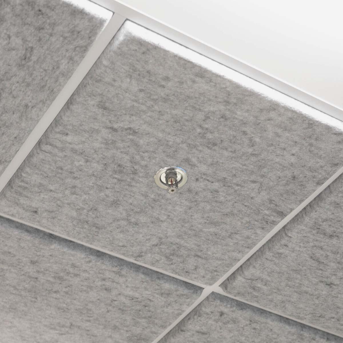 Closeup photo of a Designer Premium Acoustic Felt Ceiling Tile 1" Tegular in Pale Grey with a cutout for a sprinkler head