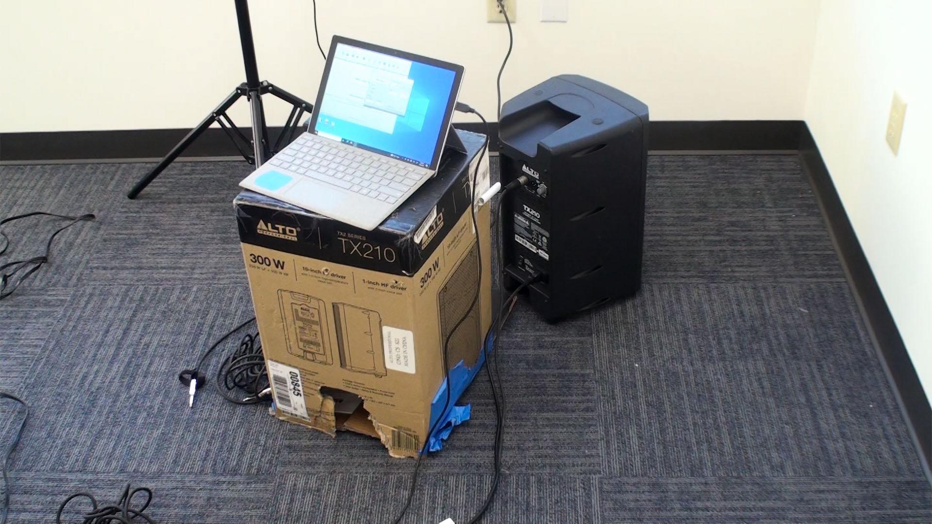 A speaker is used to generate high-intensity broad-spectrum noise for testing in adjacent spaces.