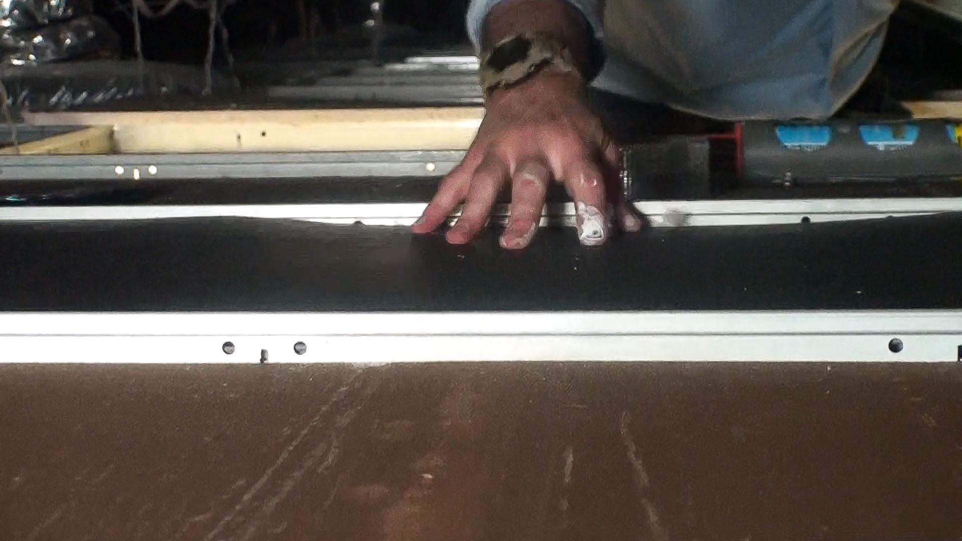 Testing a Ceiling Tile Barrier for fit to see if any area needs to be taped down