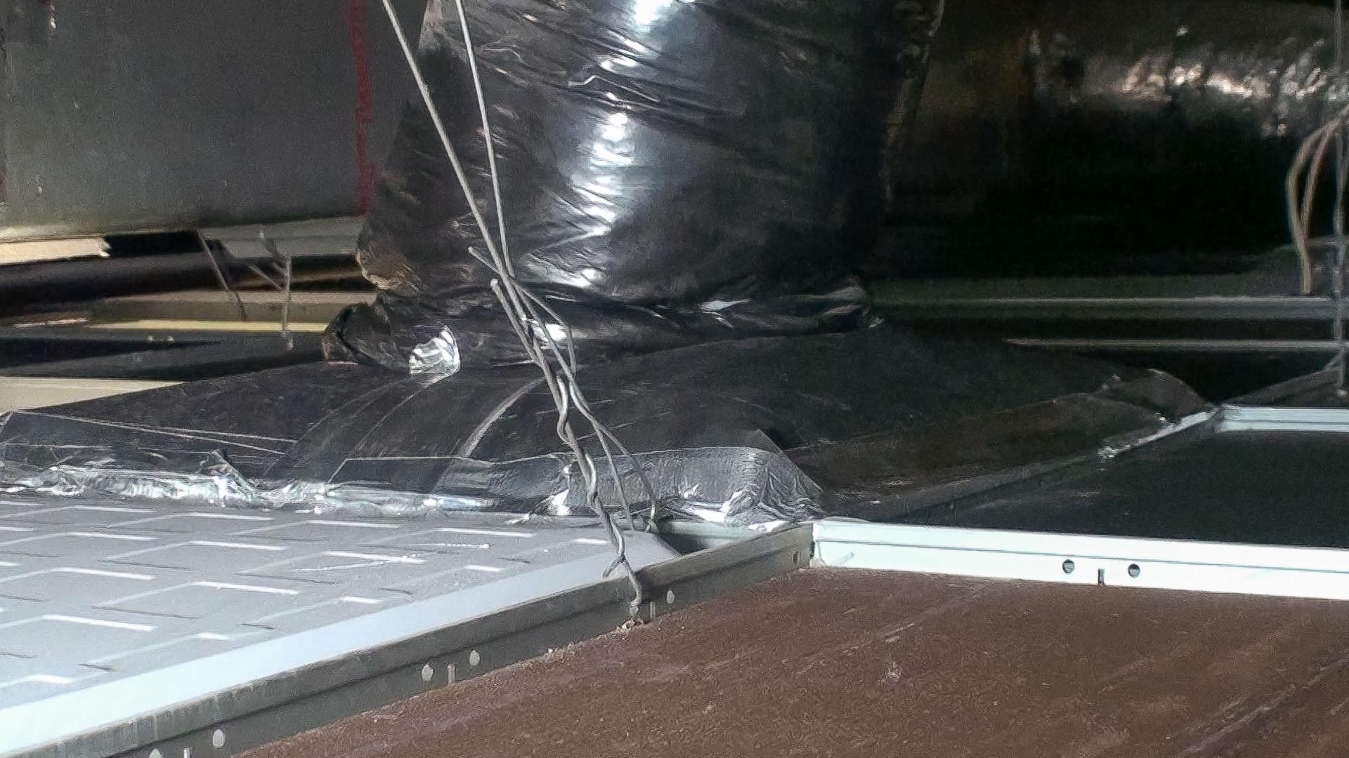 Both sides of the Ceiling Tile Barrier have been installed and taped down