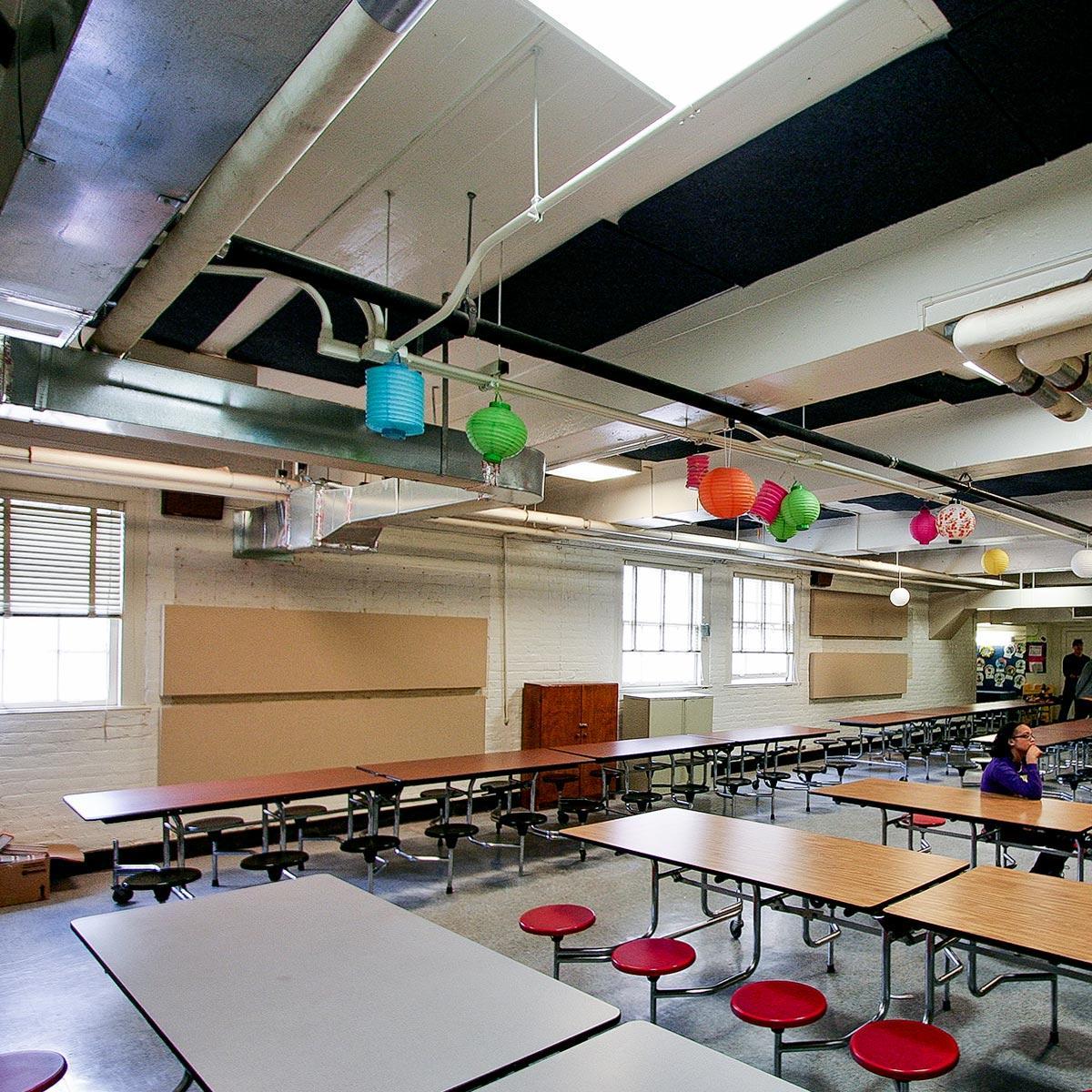 Acoustic panels on the wall and ceiling reduce sound in the Bellevue Elementary cafeteria.