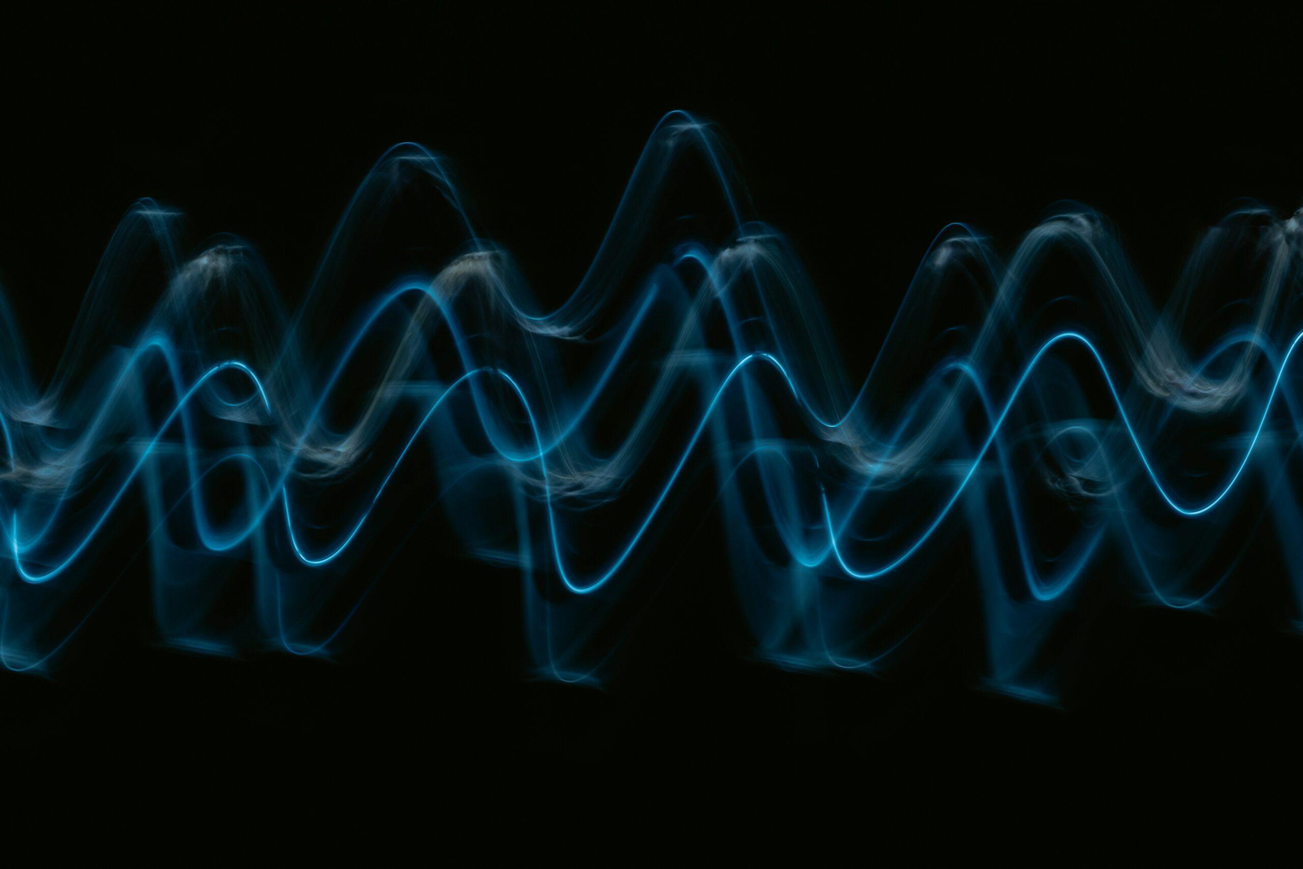 A blue waveform on a black background