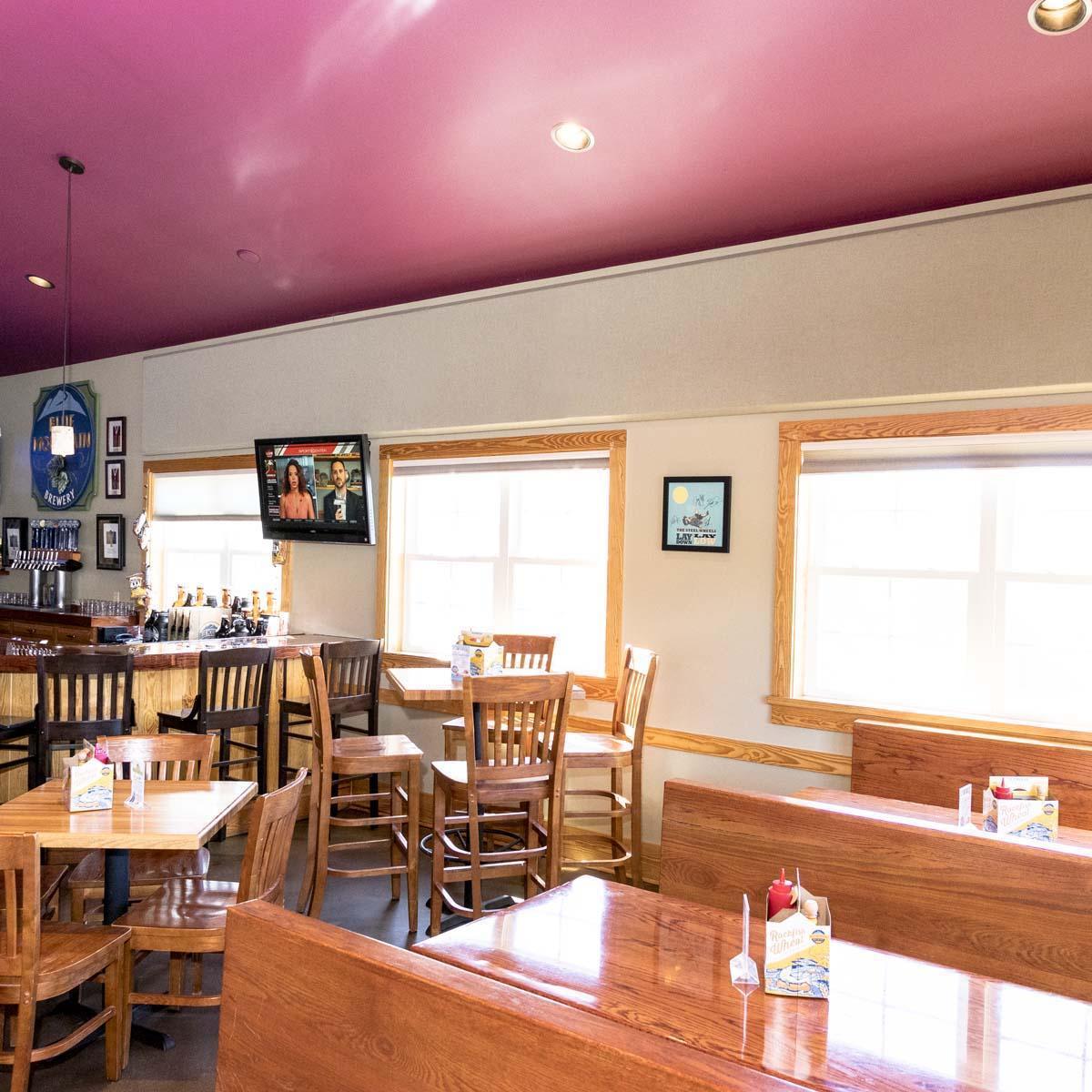  Fabric wrapped acoustic panels installed on the walls in the dining room.