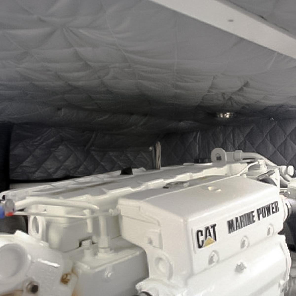 The engine compartment of a diesel powered boat lined with barrier and absorber acoustic blankets.