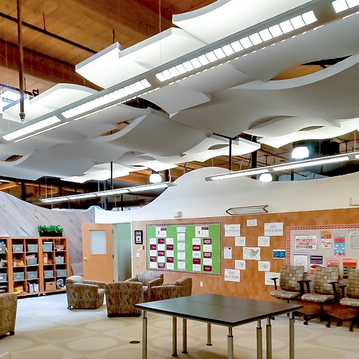 As part of the acoustic treatment, Whisperwave® Ceiling Clouds are suspended in the offices of CCA Global Partners.