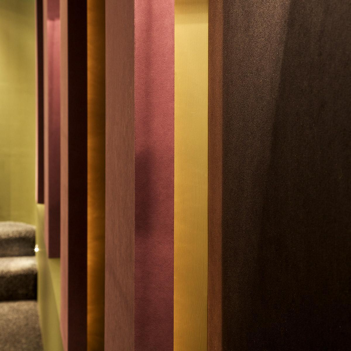 In a CEDIA honored home theater, fabric wrapped panels treat the acoustics in the space.