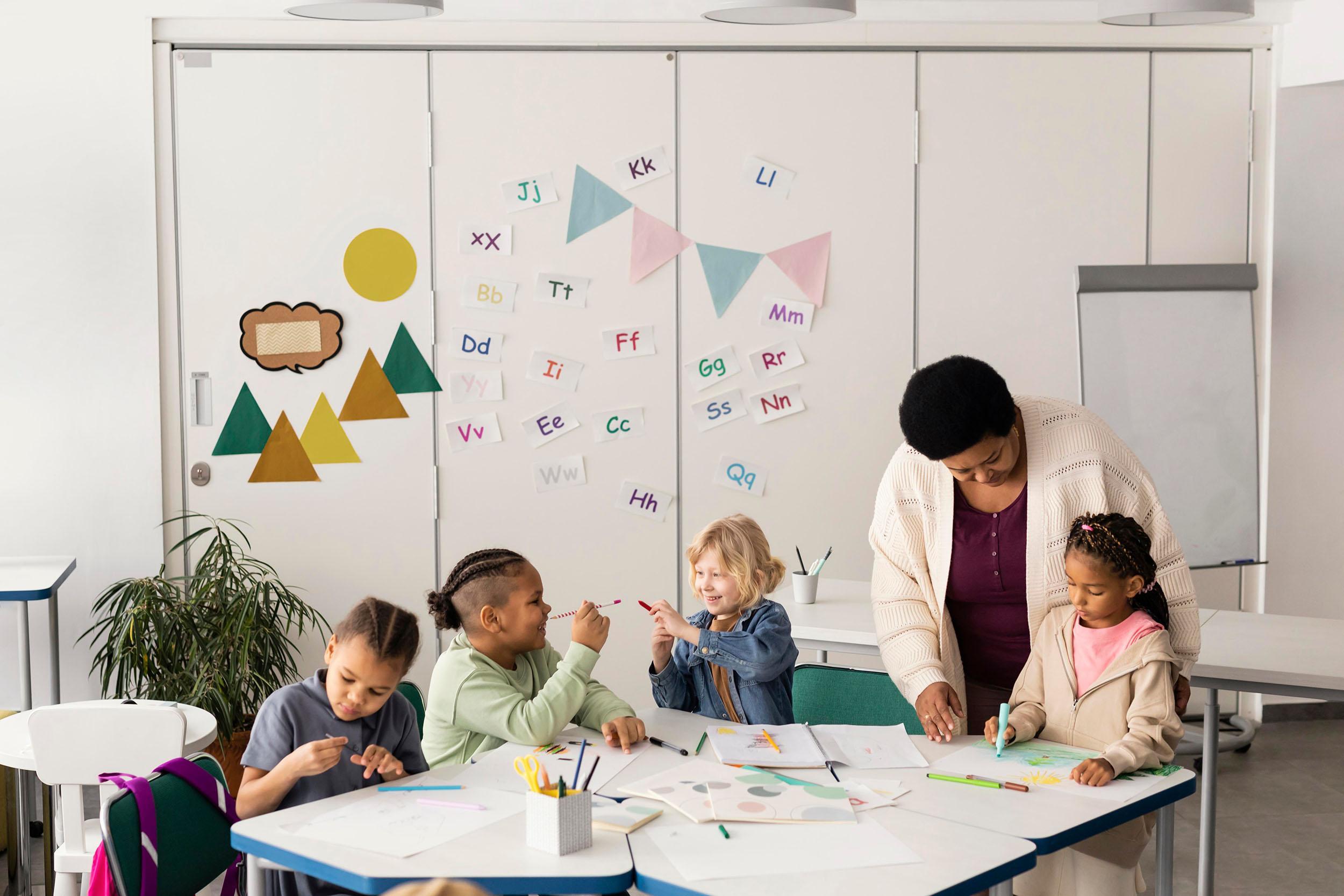Children drawing together in a classroom