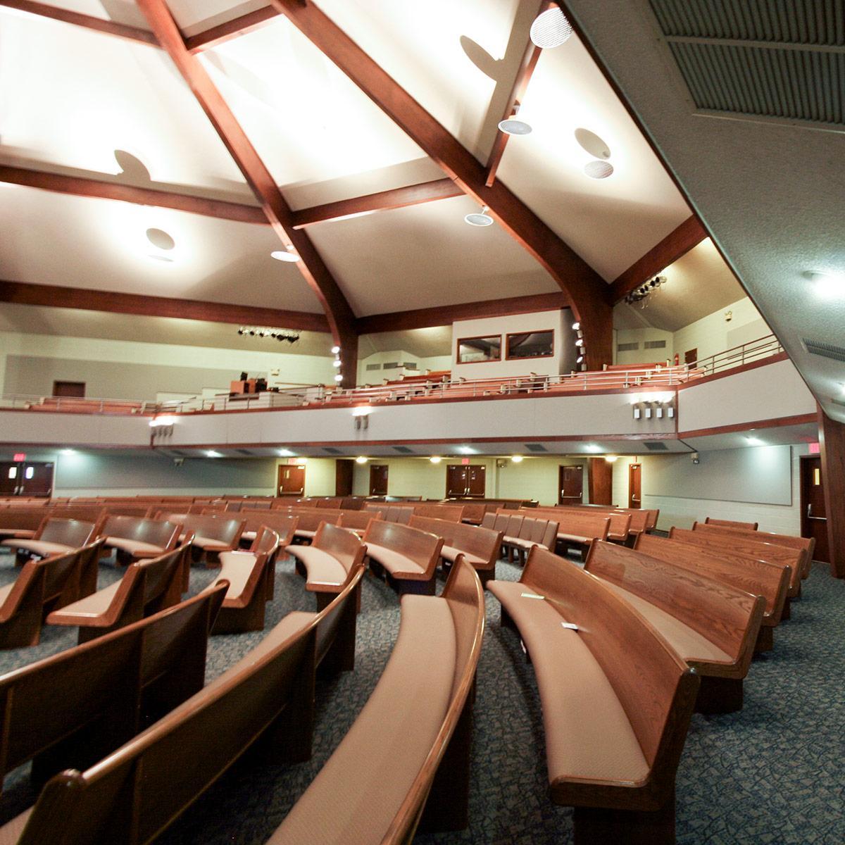 In the auditorium at Church of Christ at Mountain View,  fabric wrapped panels reduce reverberation.