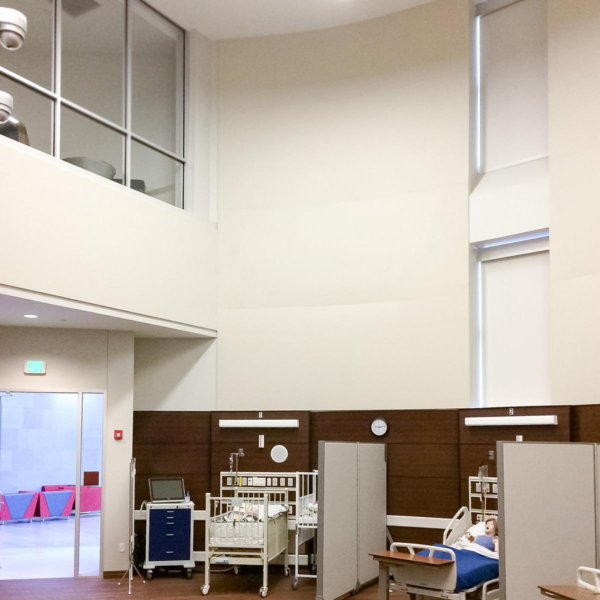 Collin College Healthcare SIM Lab utilized a stretch wall system and fabric wrapped acoustical panels to improve the educational environment of this medical simulation laboratory.