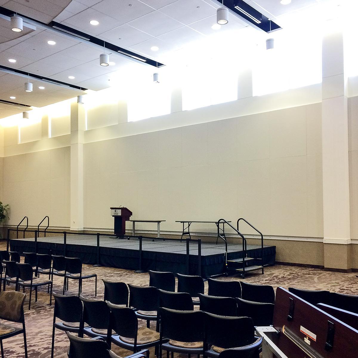 Fabric wrapped acoustic panels on the walls of the Collin College Preston Ridge Conference Center.