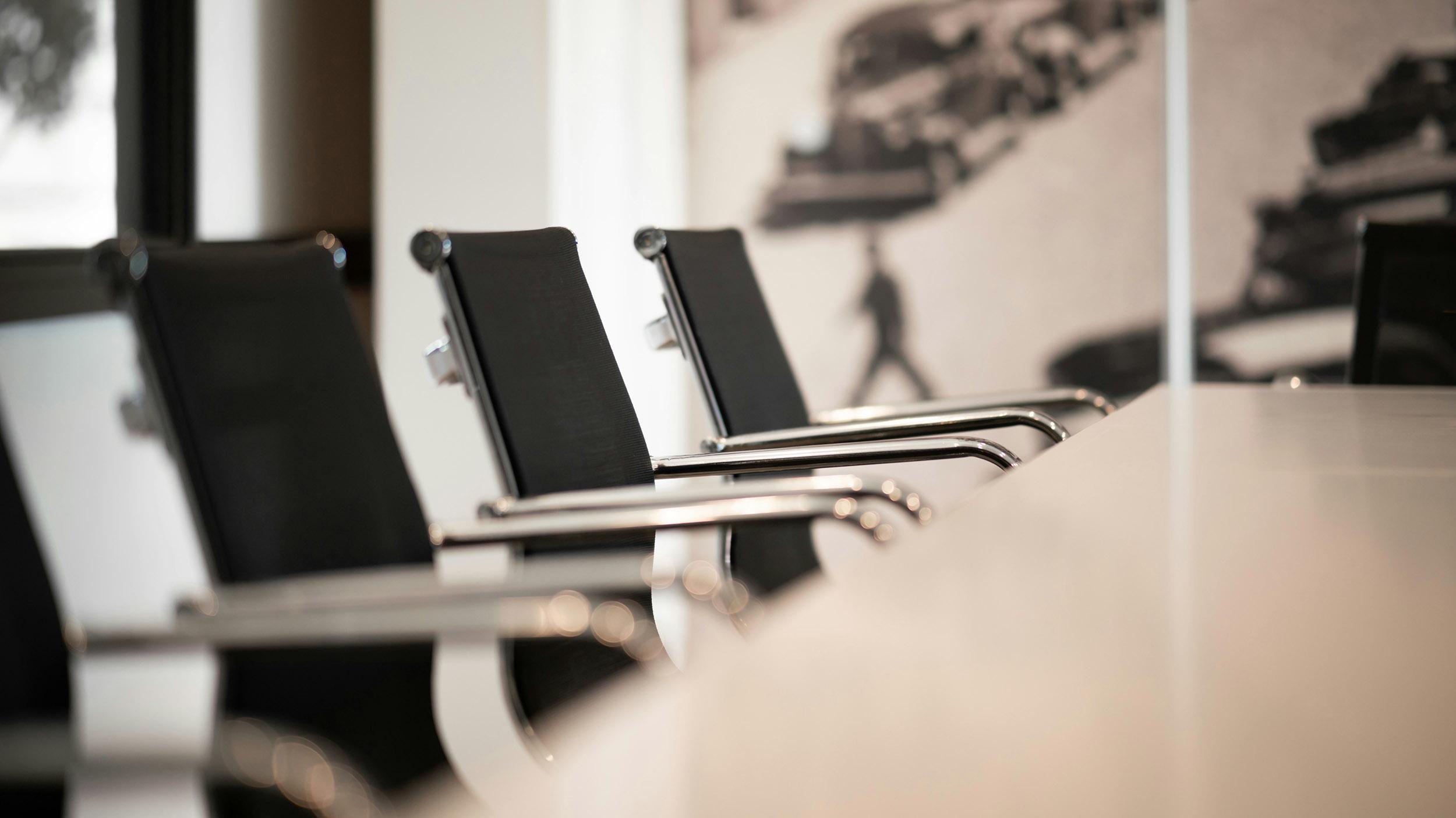Mixed focus image of office conference room chairs Photo by Michael Fousert on Unsplash