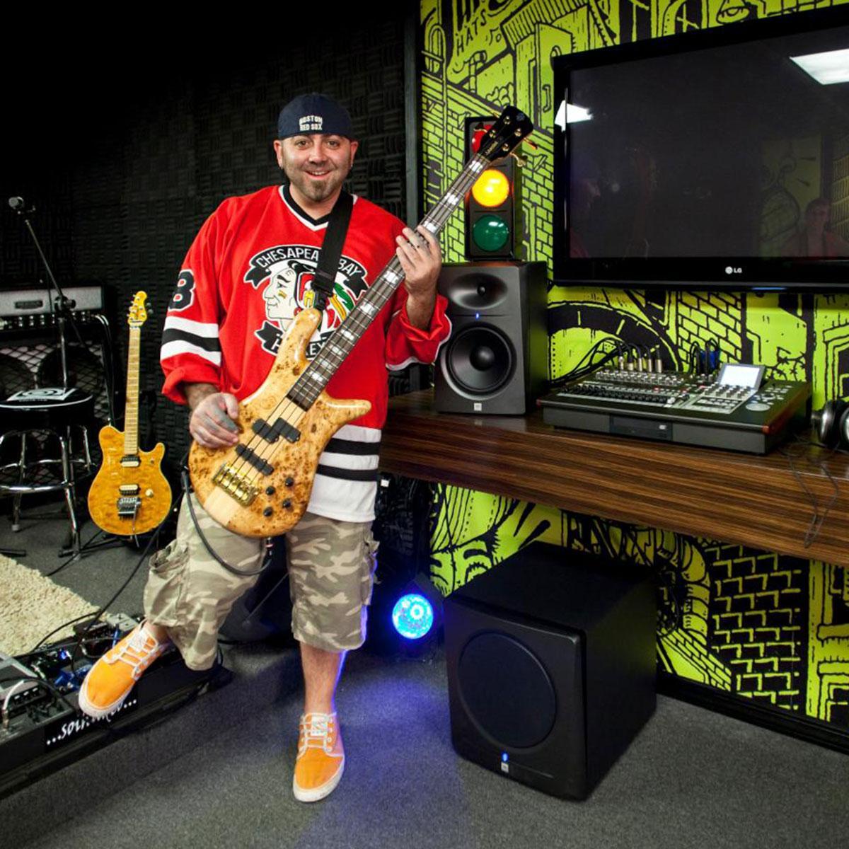 Food Network’s Ace of Cakes host Duff Goldman in the completed man cave, as seen on DIY Network’s Man Caves.