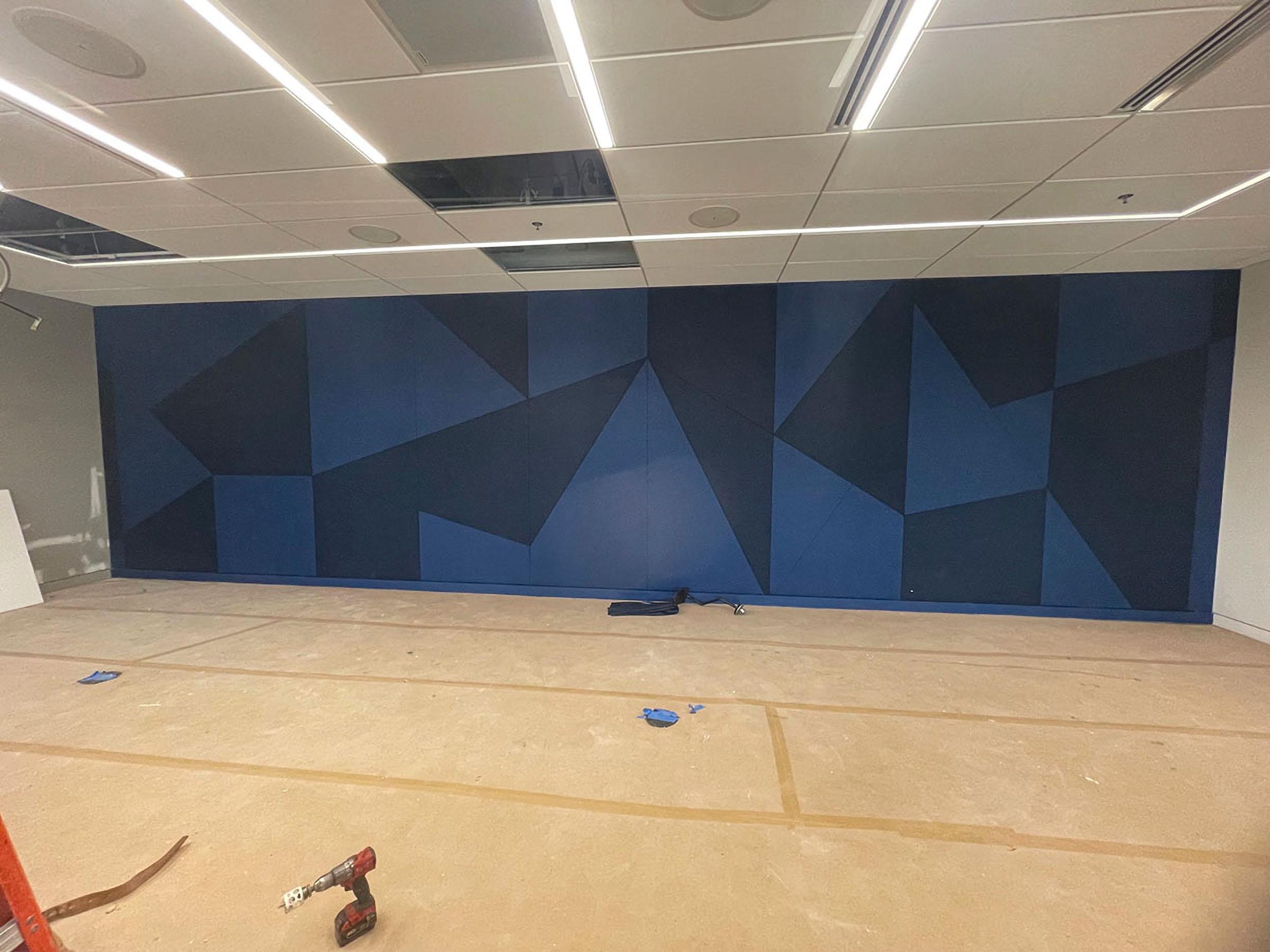 Acoustiwall installation at EAB headquarters with custom geometric design