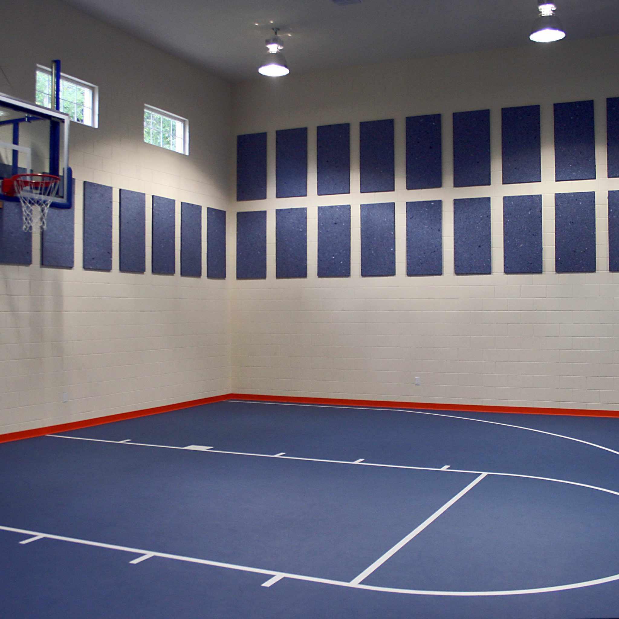 EcoSorpt® Cotton Acoustic Panels on the walls of this multipurpose room gymnasium are an economical acoustic solution.