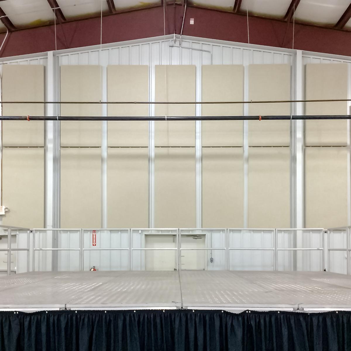 View of stage and acoustic panels installed on wall of Fannin County Community Event Space
