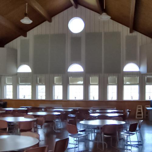 Fabric wrapped panels line the walls of the fellowship hall at the First Baptist Church of Rutherfordton to reduce reverberation.
