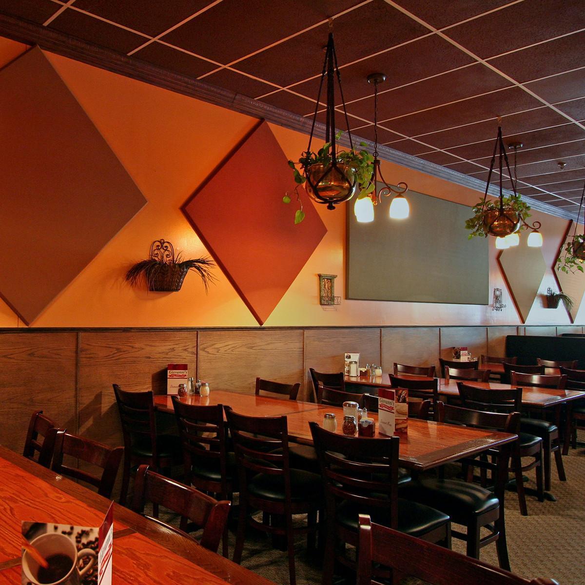 At Giovanni's Restaurant, fabric wrapped acoustic panels reduce noise in the dining room.