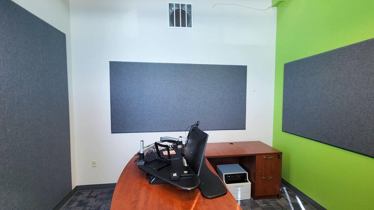 Fabric wrapped acoustic panels on the walls of the offices of GT Aubert Construction.