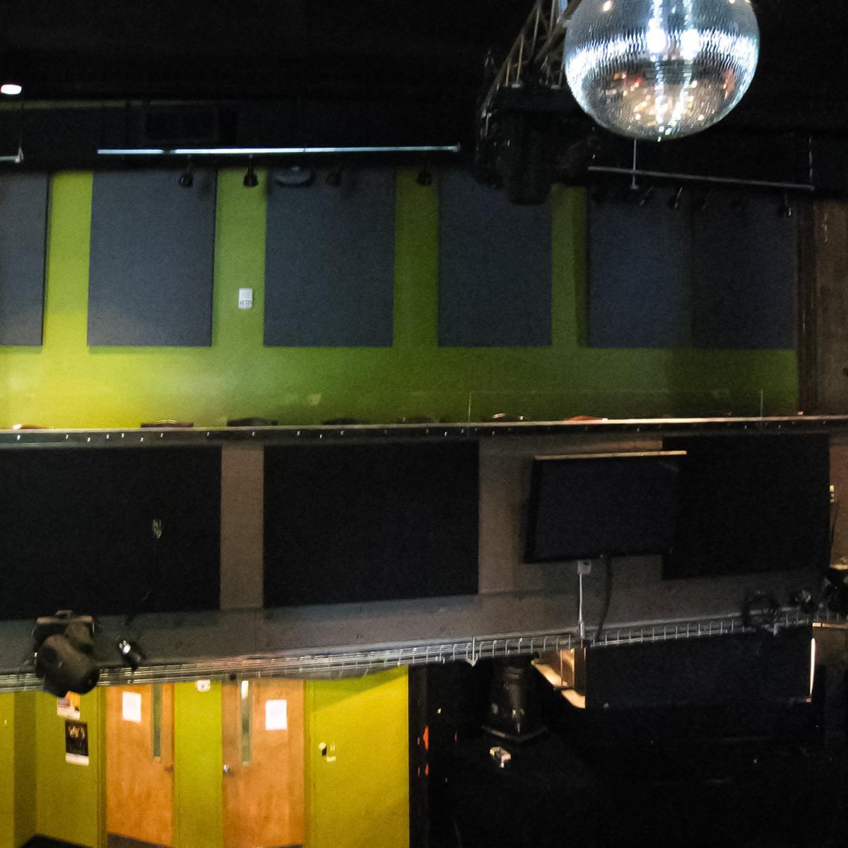 Sound absorbing fabric wrapped panels on upper walls at The Hat Factory