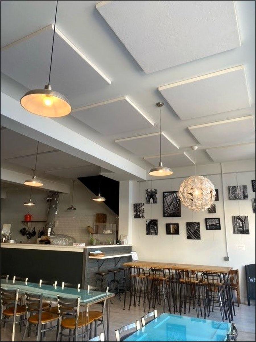 Acoustic panels on the ceiling of a brewery reduce echo in the tasting room.