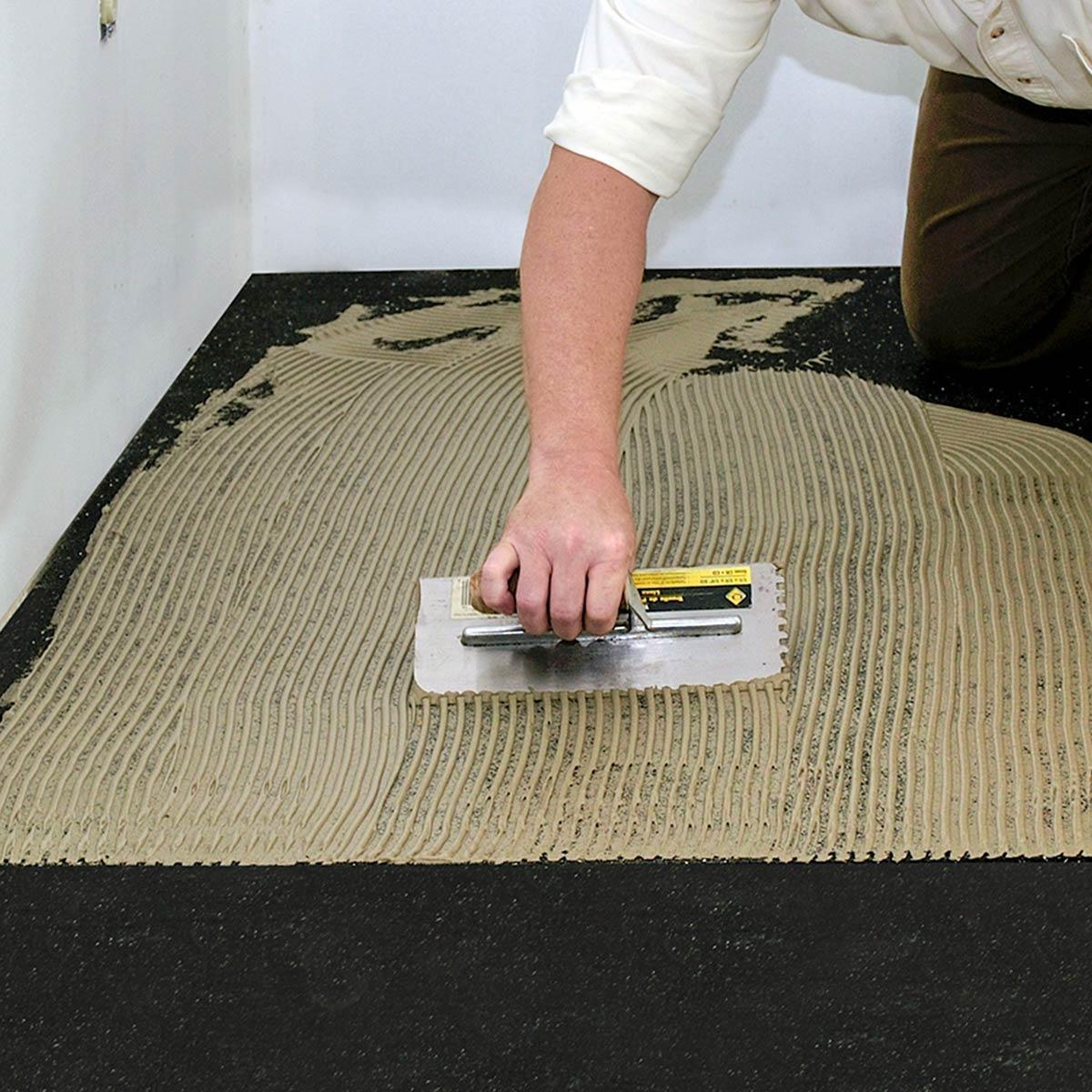 Apply adhesive to the Iso-Step® using recommended trowel size.