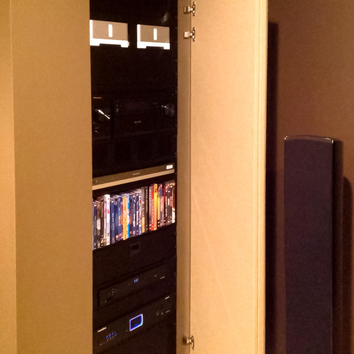 In Jeff B.'s home theater, fabric wrapped panels treat the acoustics in the space.