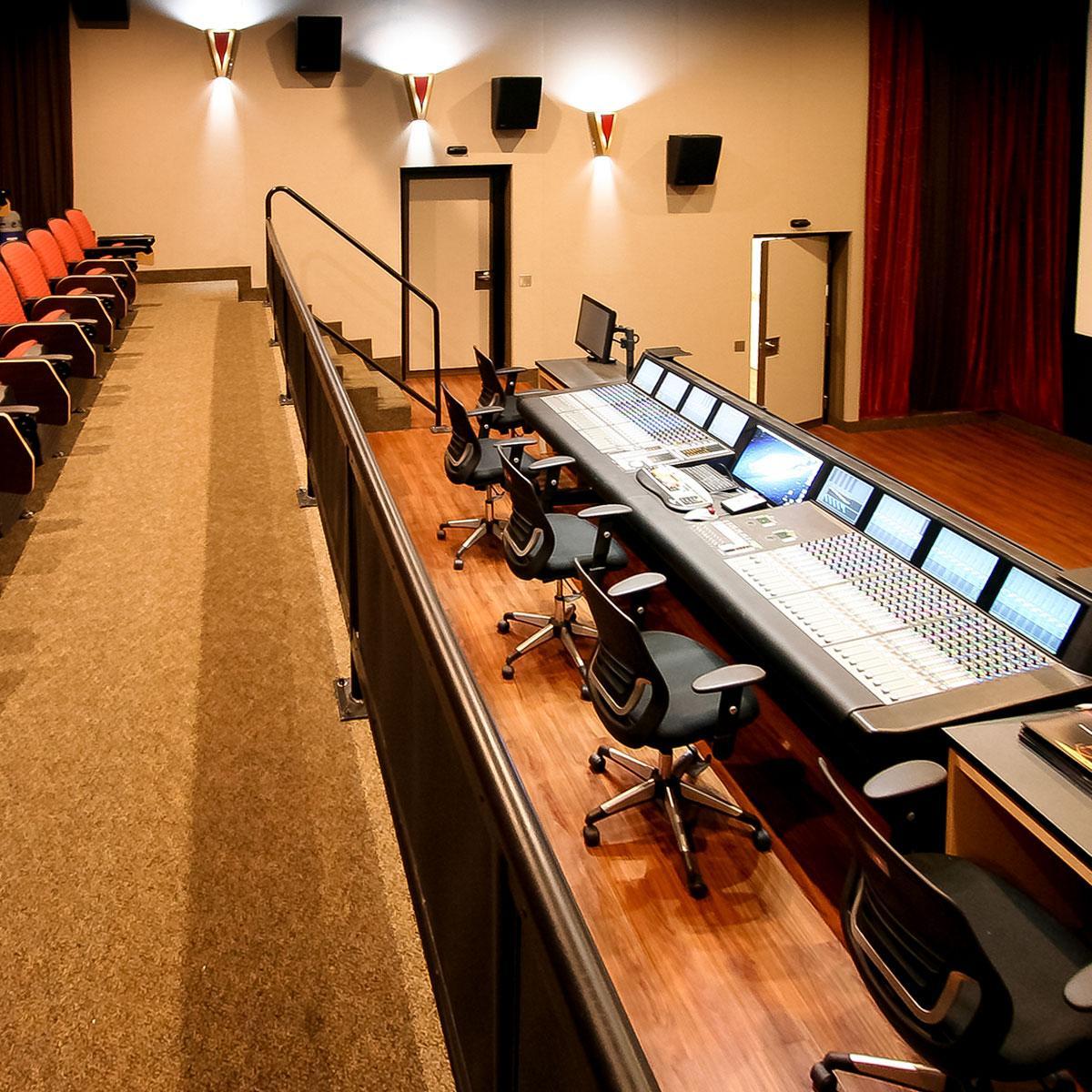 Liberty University Mixing Room high STC doors, acoustic stretch wall system and speak covers under screen.