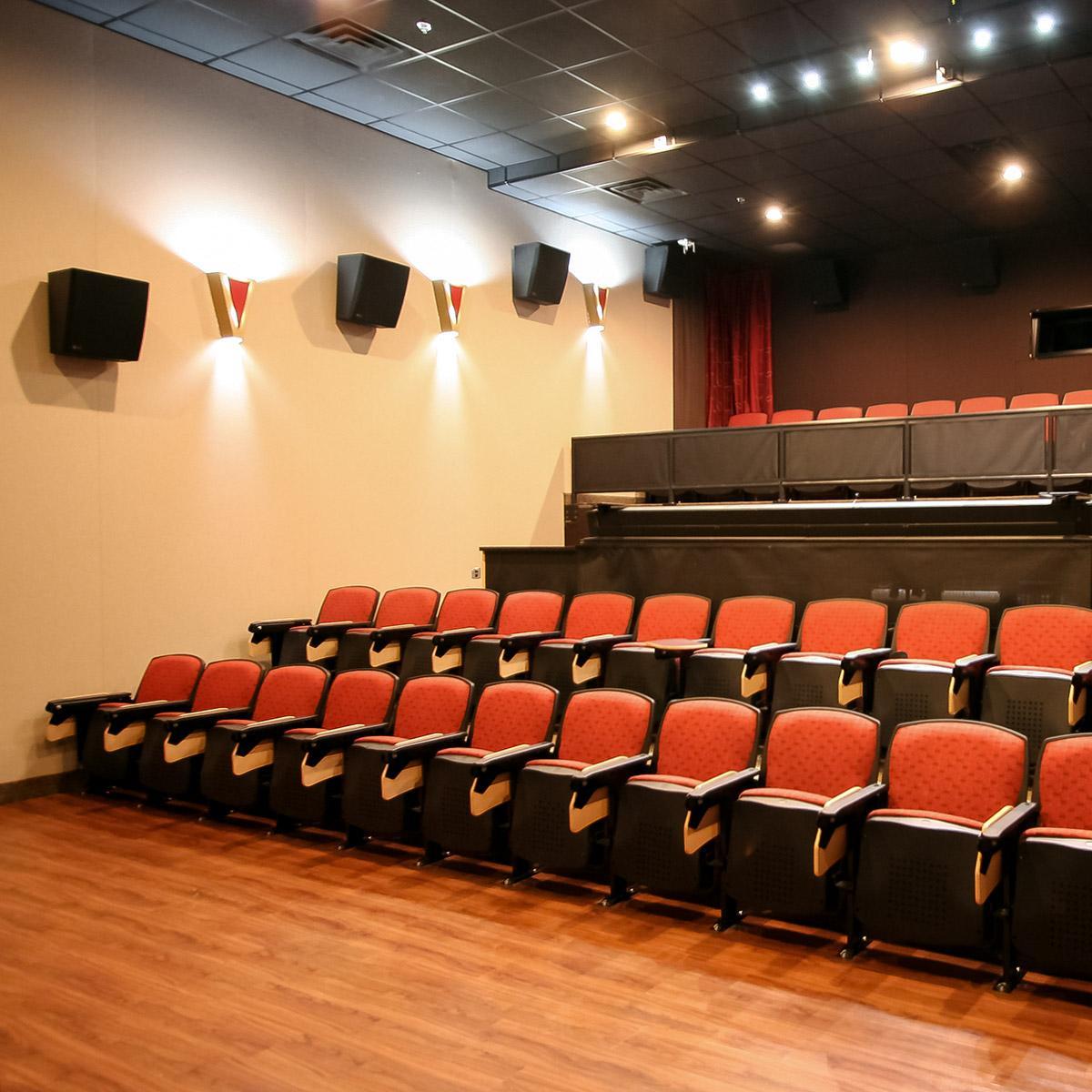 Liberty University Mixing Room using Stretch wall system for side wall acoustics and speaker covers under the screen.