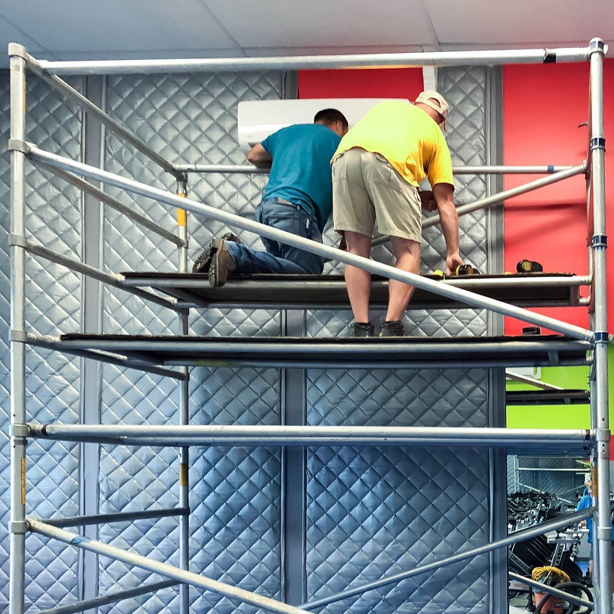 MAC Fitness easily installs PrivacyShield® Absorptive Soundproofing Blankets as a temporary barrier wall. Custom manufactured to size, the sound blankets arrive ready to hang.