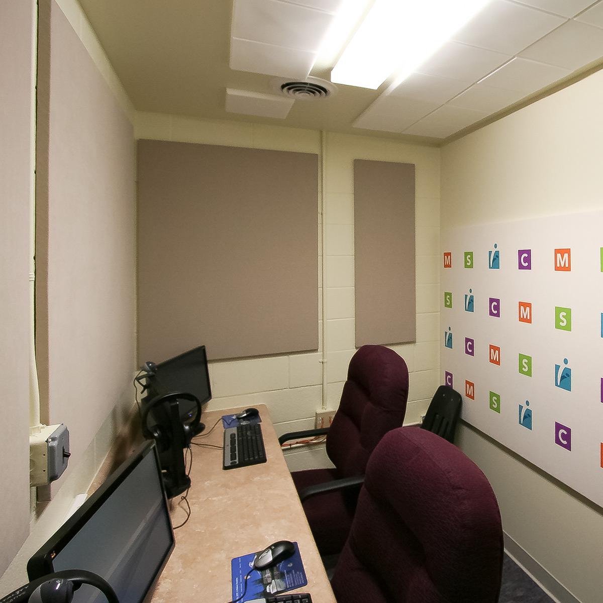 MathScience Innovation Center Room for distance learning using AcoustiArt fabric wrapped acoustic panels for a backdrop.