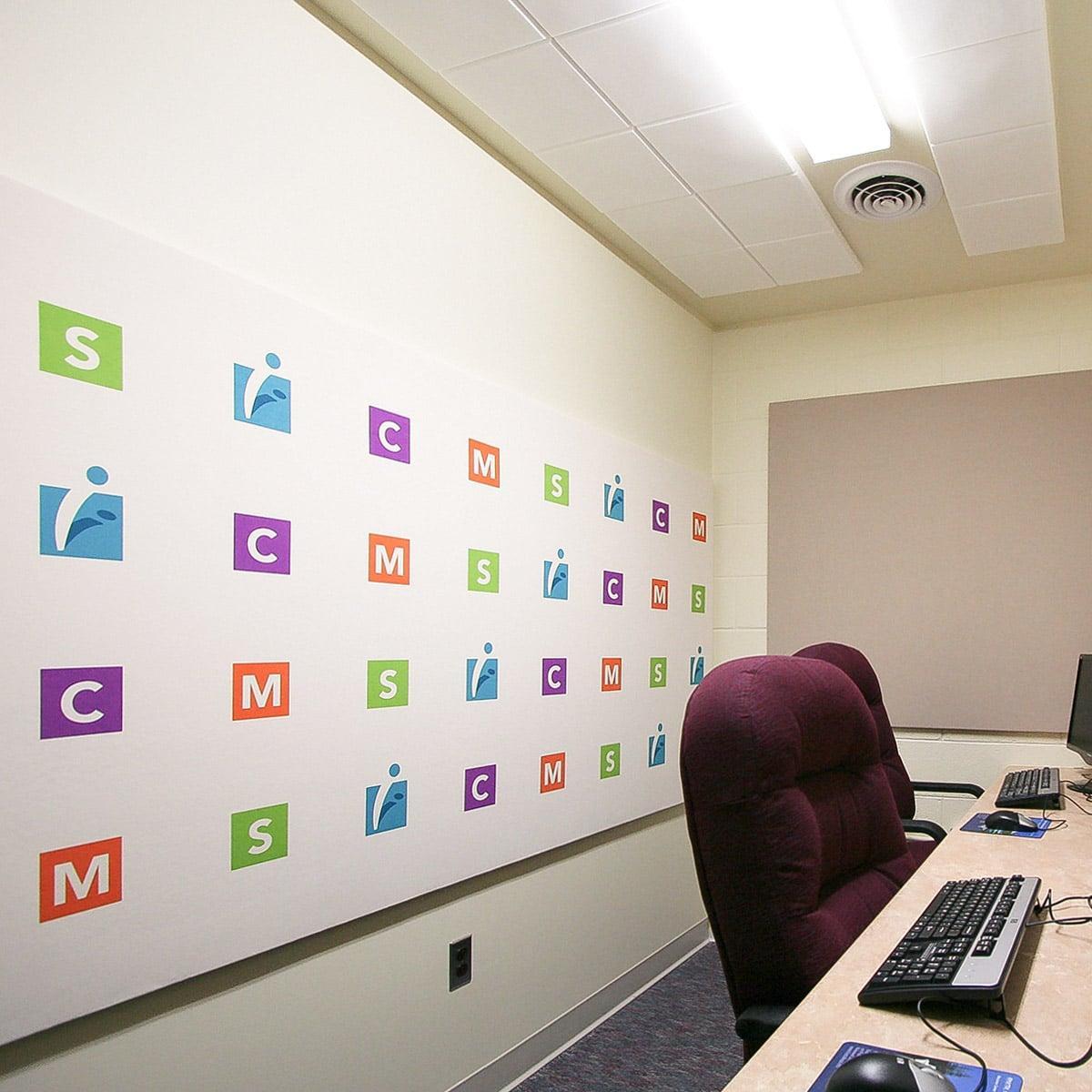 MathScience Innovation Center Room for distance learning using AcoustiArt fabric wrapped acoustic panels for a backdrop.