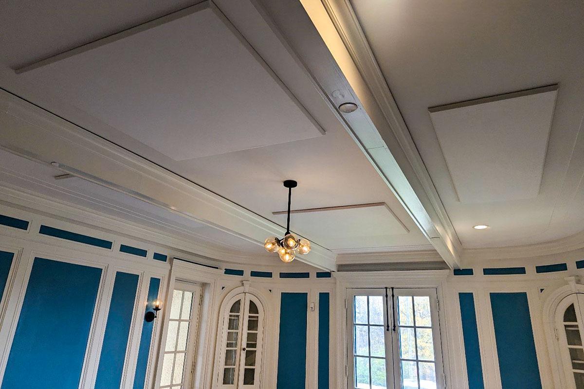 Fabric wrapped acoustic panel treatment on the ceiling of the Maymont Westover blue room.