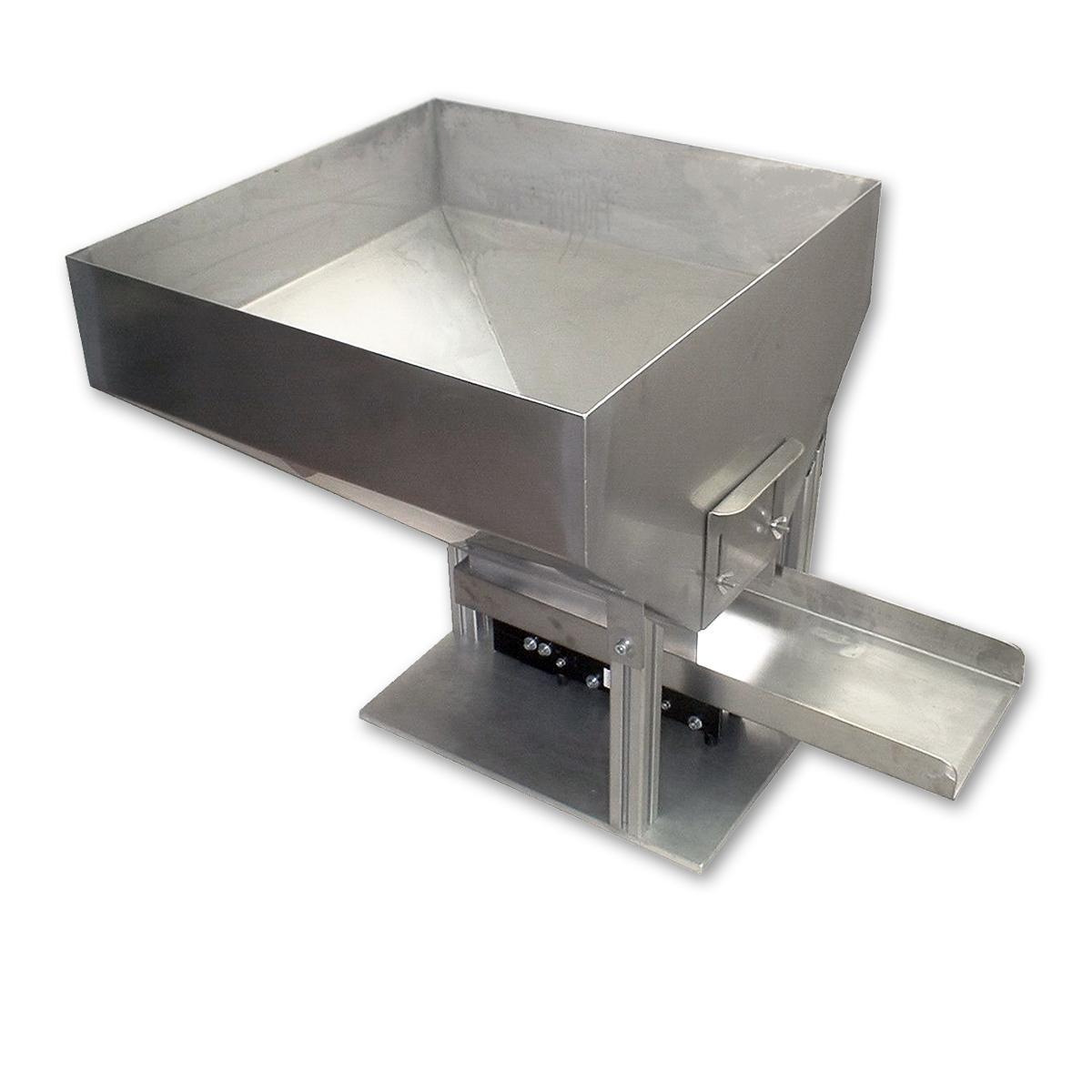 Vibratory feeder using damping compound on feeder to reduce metal to metal noise.